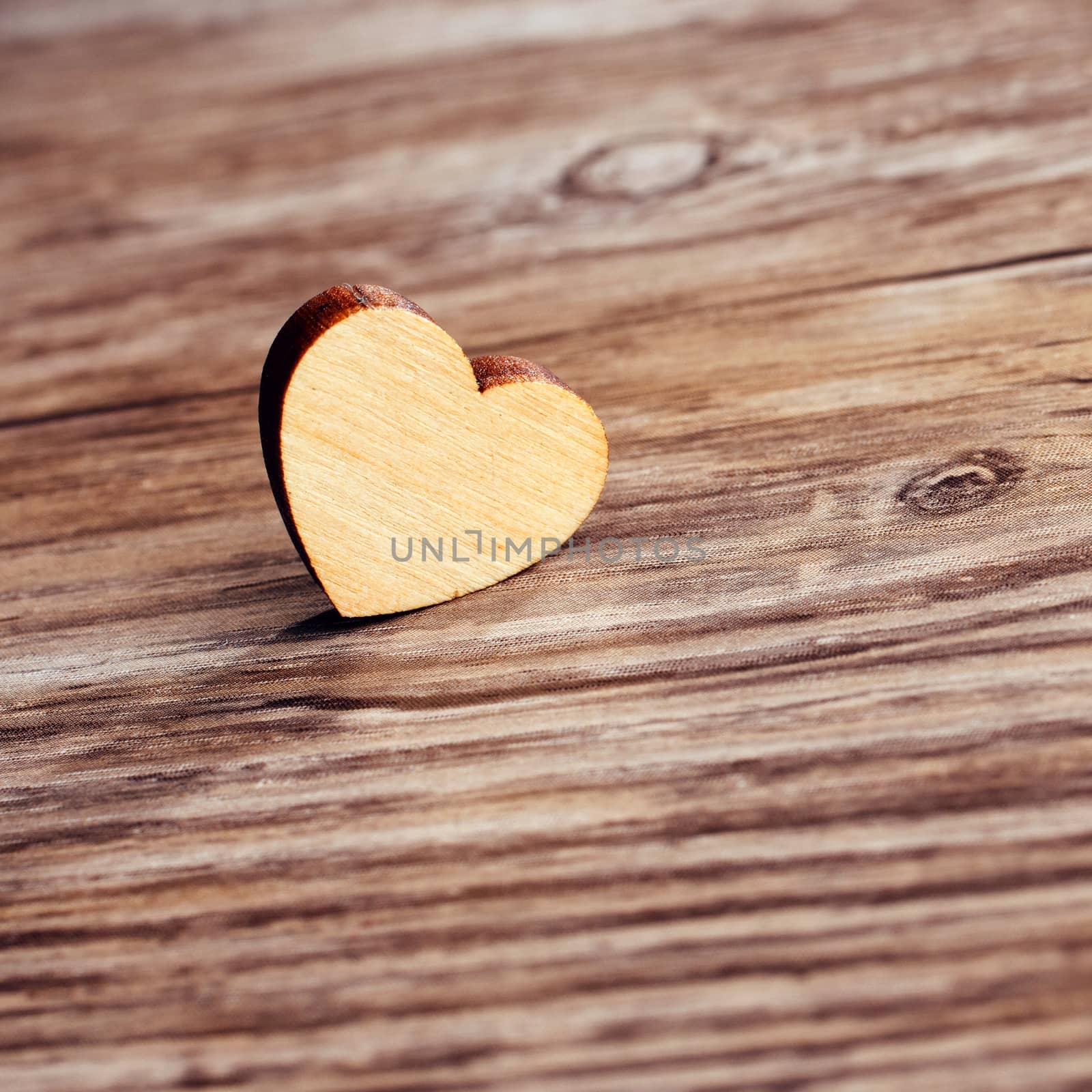 small heart on wooden board