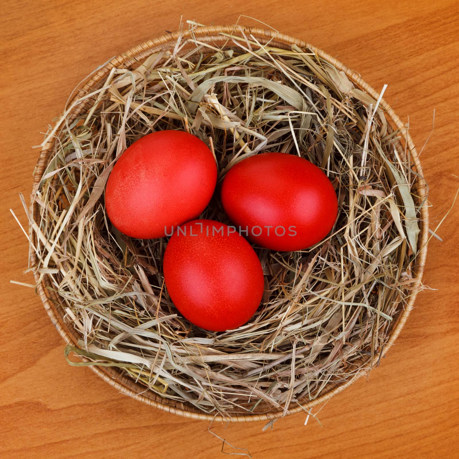 red Easter eggs in the nest