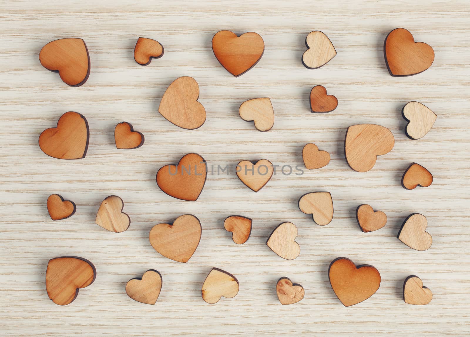 wooden hearts on a light surface