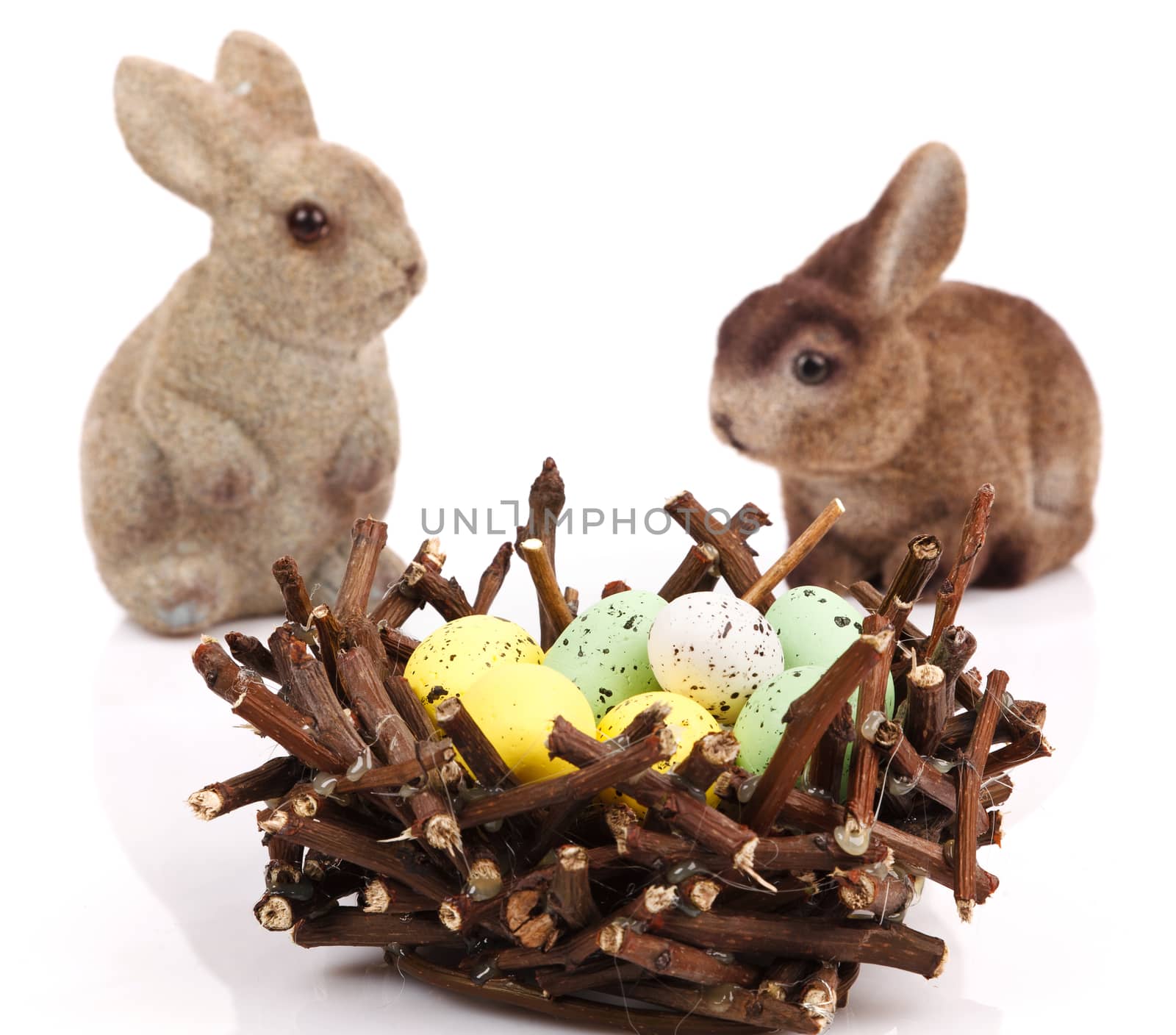 Bunnies with Easter eggs isolated on white background