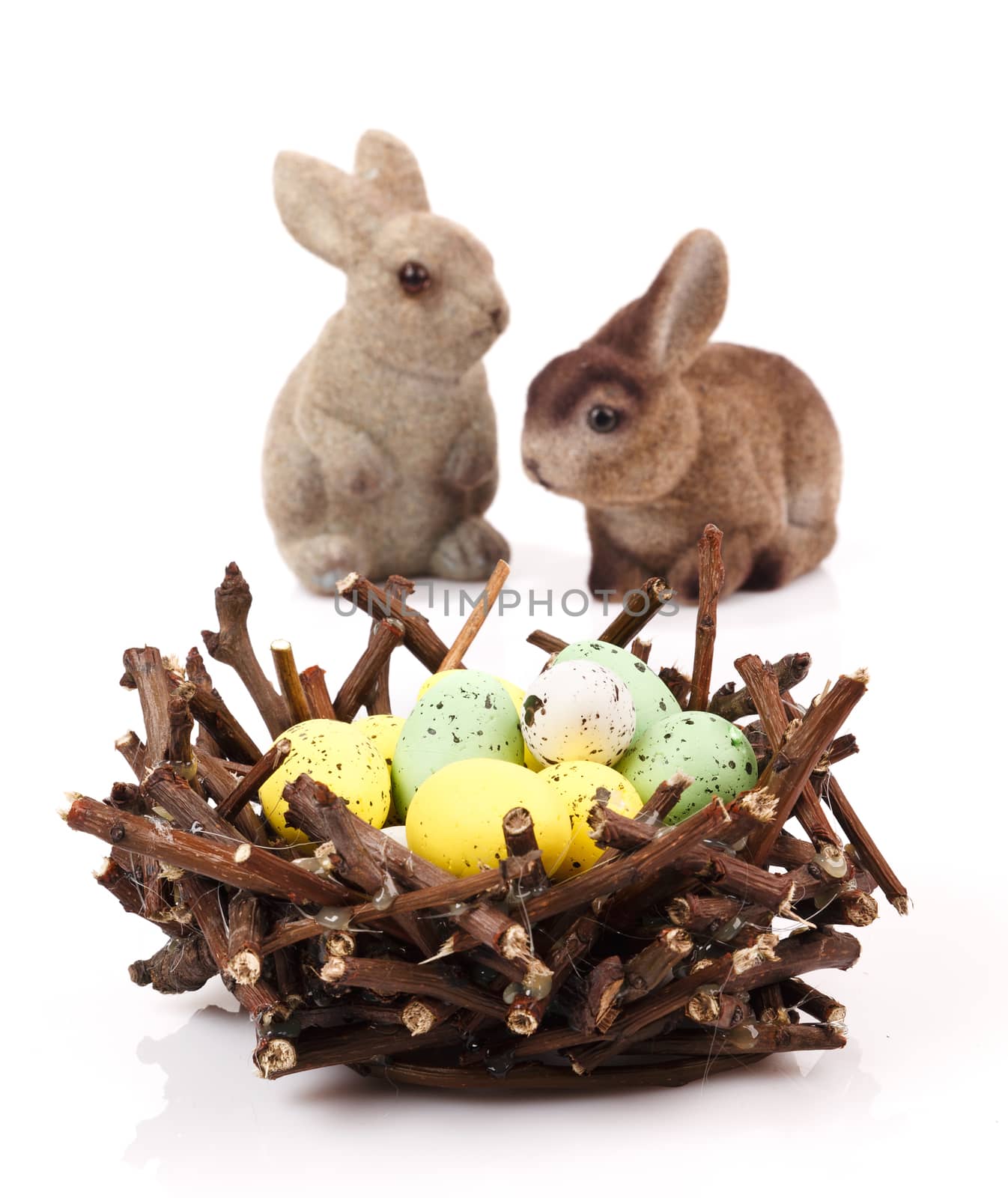 Bunnies with Easter eggs isolated on white background