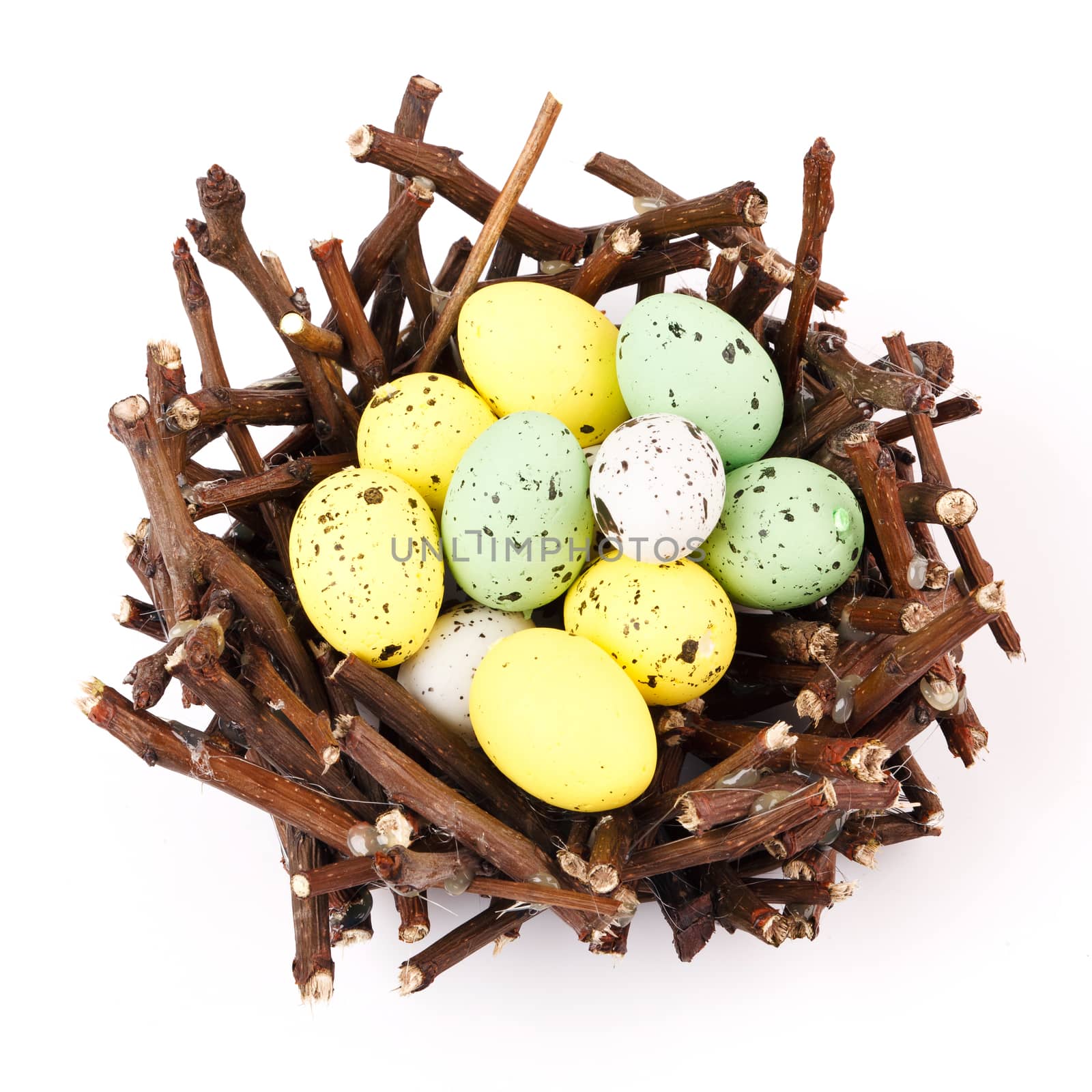 Nest with easter eggs isolated on white background