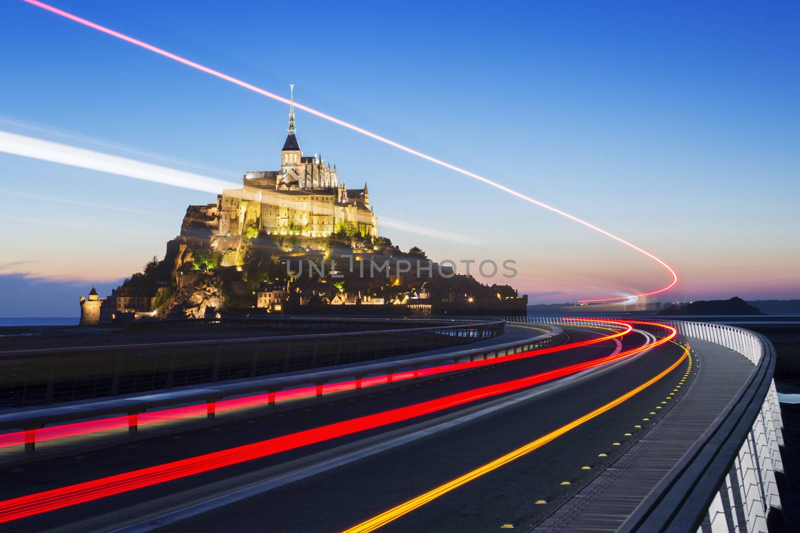 Mont Saint Michel at dusk with bus light, Normandy. France