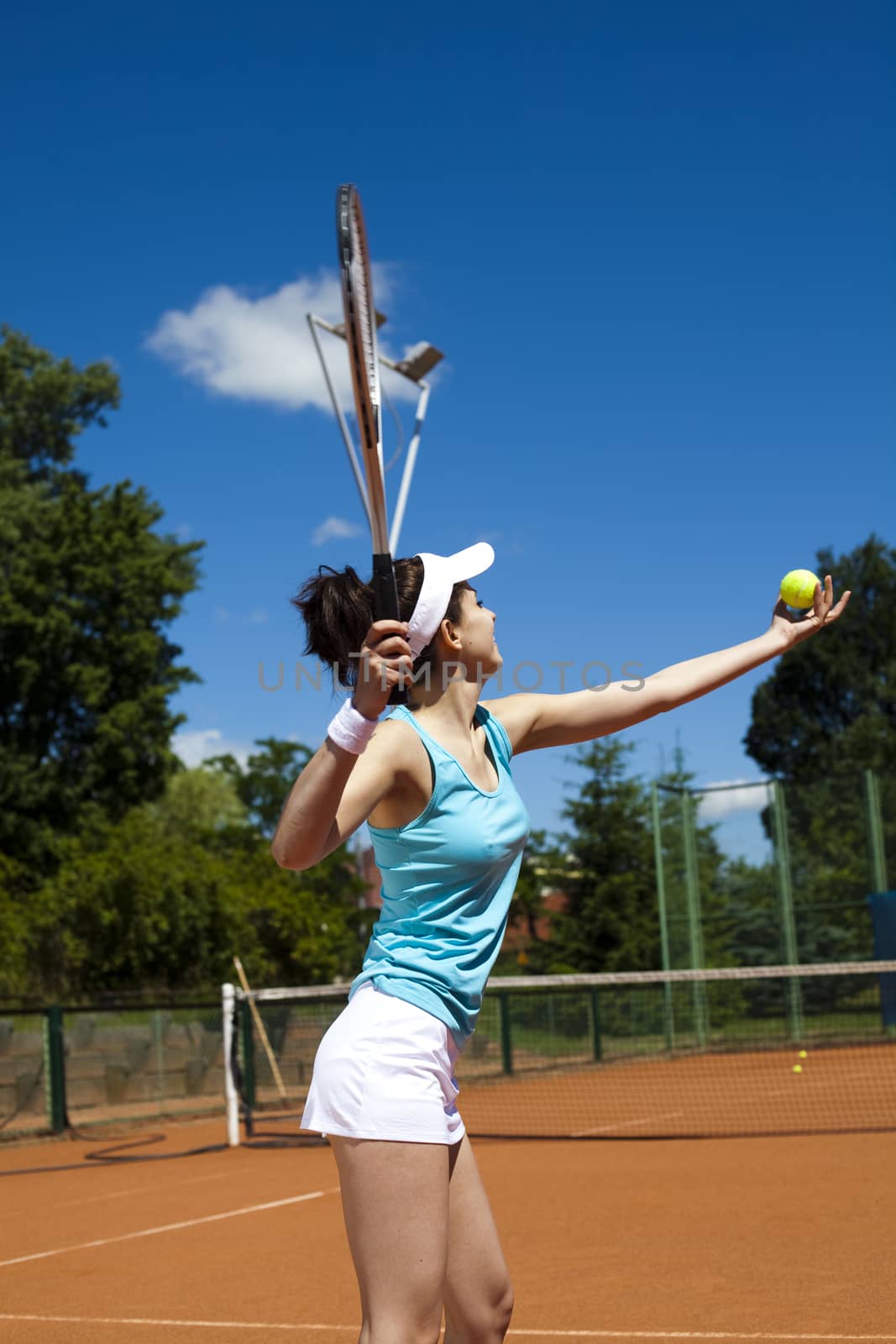 Woman playing tennis, natural colorful tone by JanPietruszka