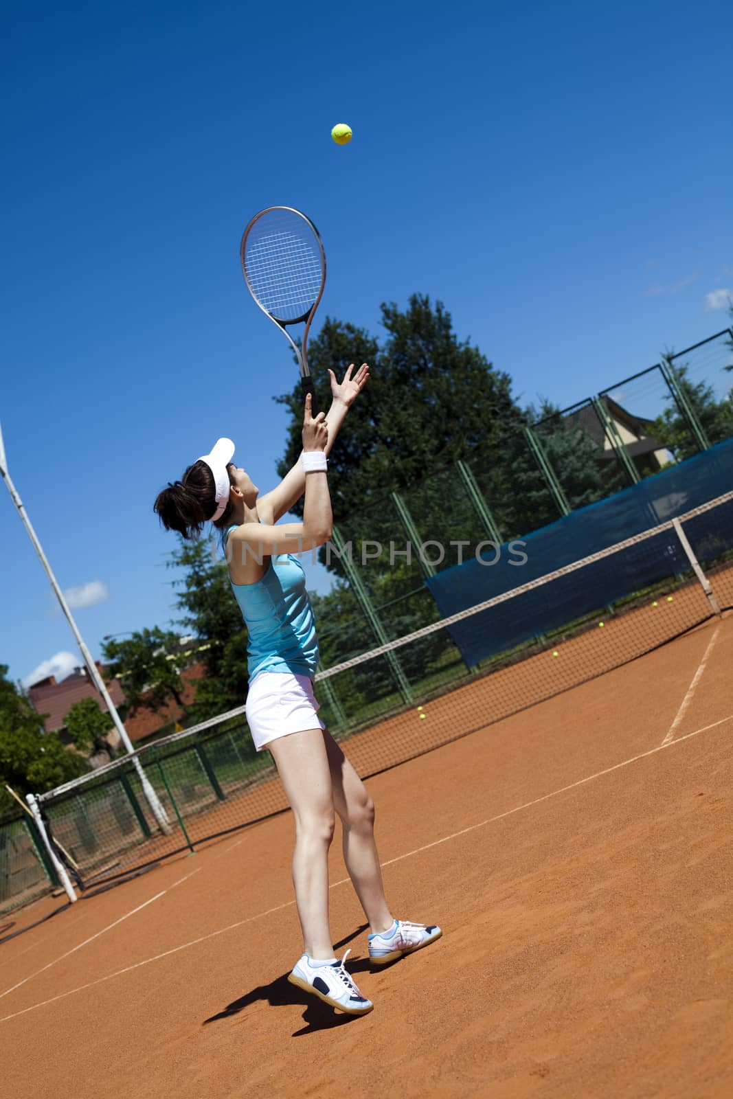 Woman playing tennis, natural colorful tone by JanPietruszka