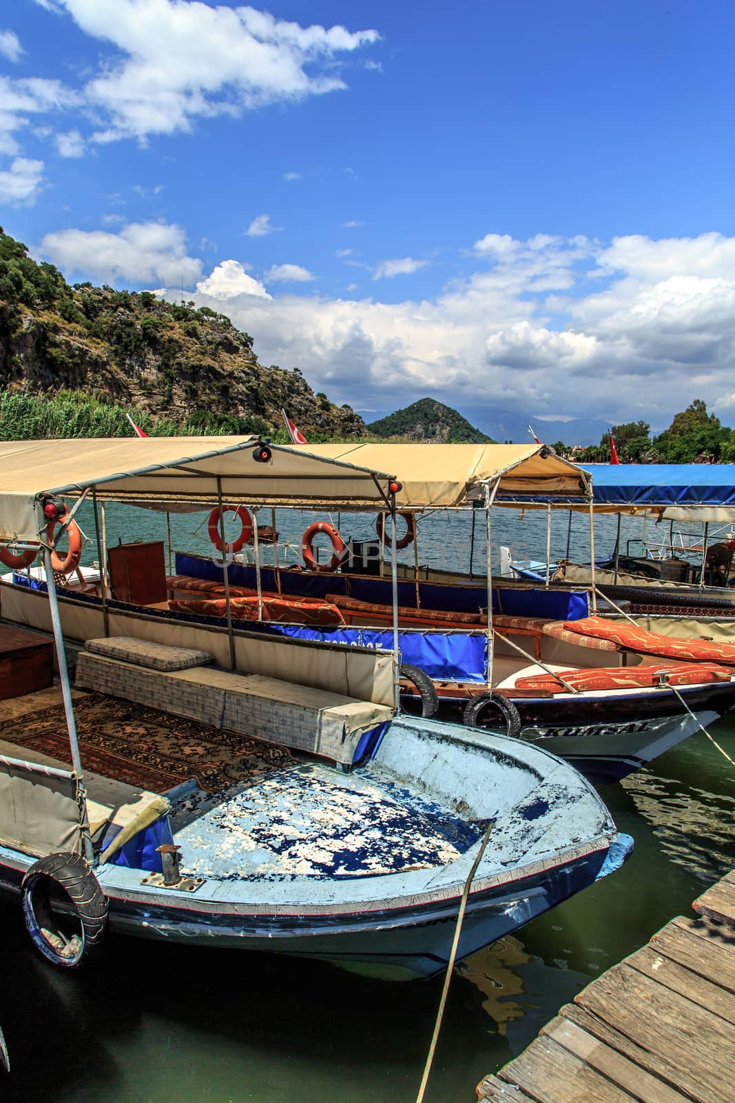 DALYAN, TURKEY - MAY 31, 2015 : Boats for touristic boat trips in the river between Koycegiz Lake and Iztuzu Beach in Dalyan.