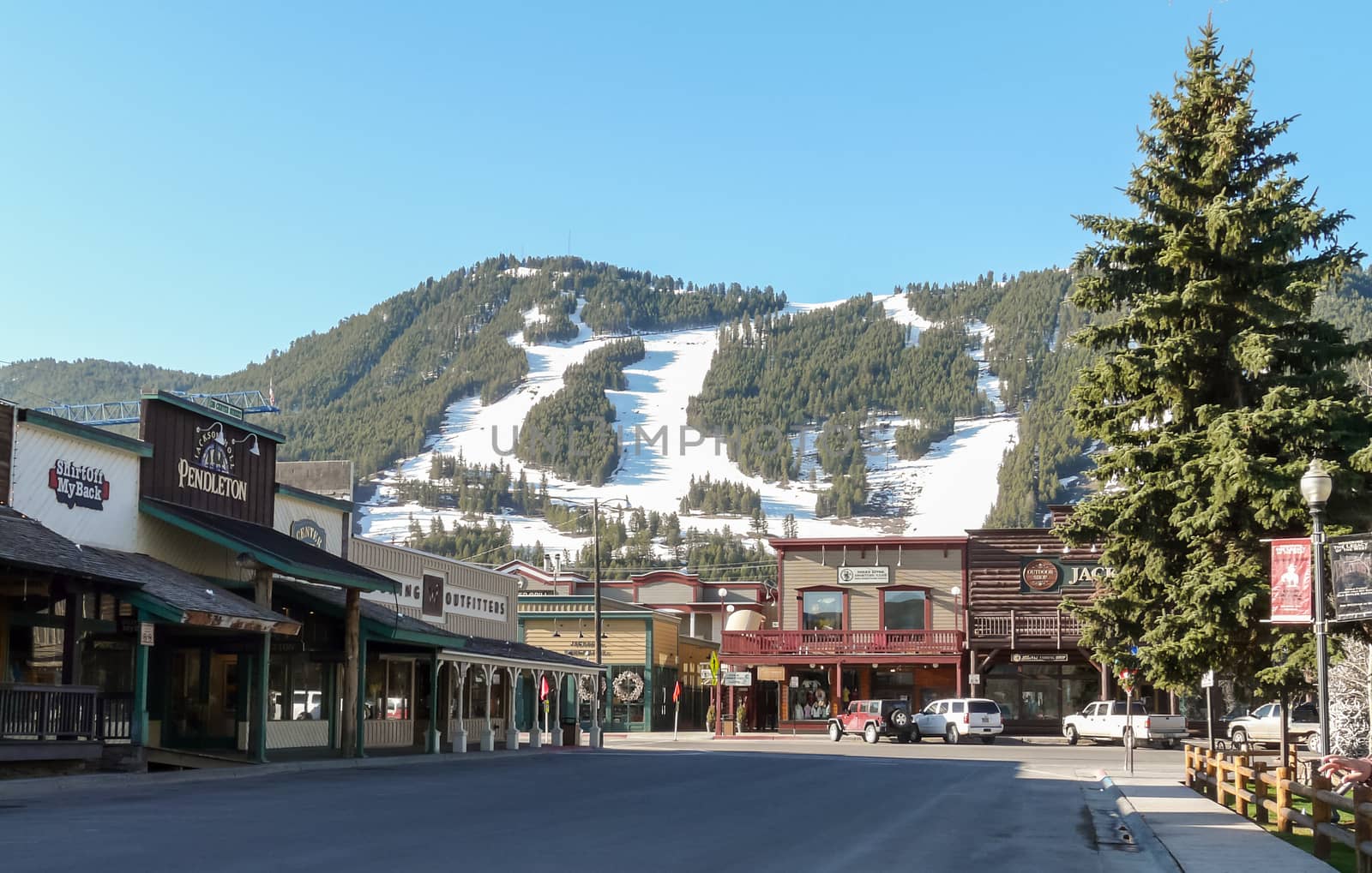 Jackson Hole, WY, USA - May 13, 2008: Ski slopes in Jackson Hole with panorama of vintage houses.