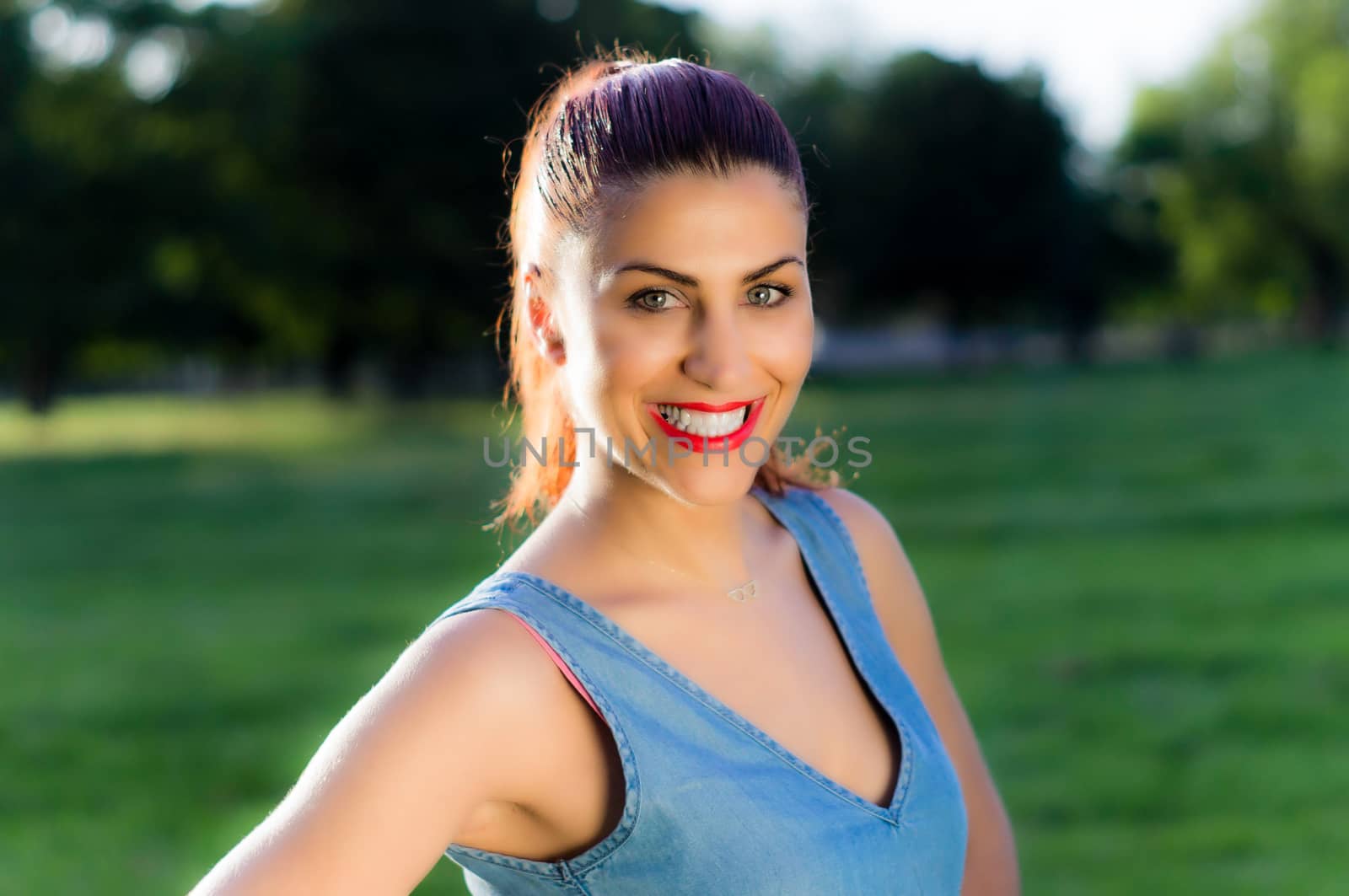 Close Up Portrait of Young Woman Smiling in a Park