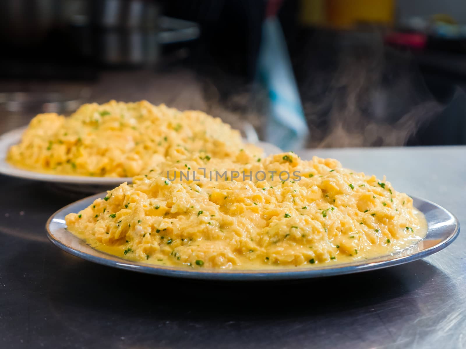 Two Scrambled Eggs Omelet Plates in a Restaurant Kitchen
