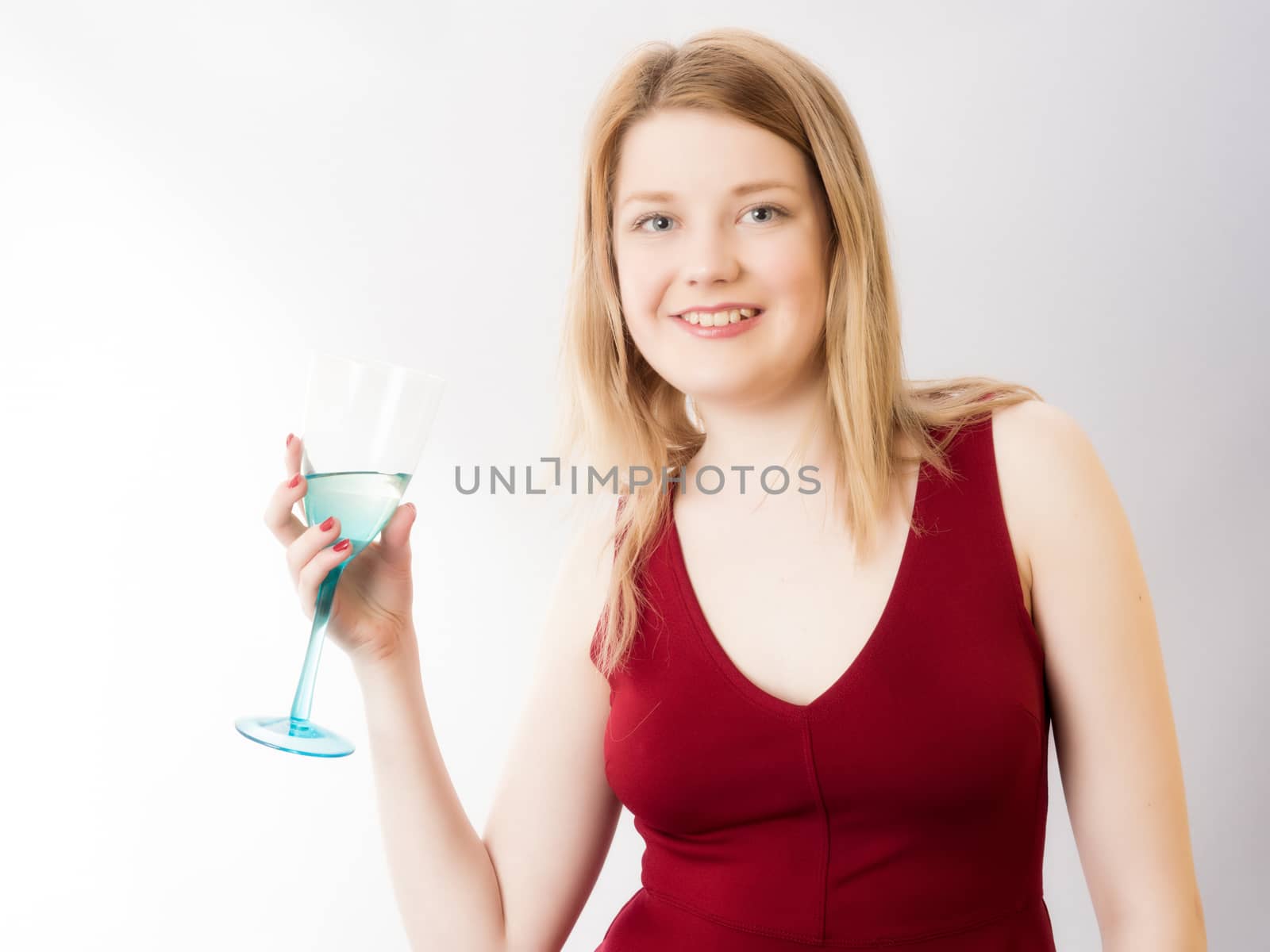 Blond in Red Dress and Drinking Glass of Wine  by PhotoLondonUK
