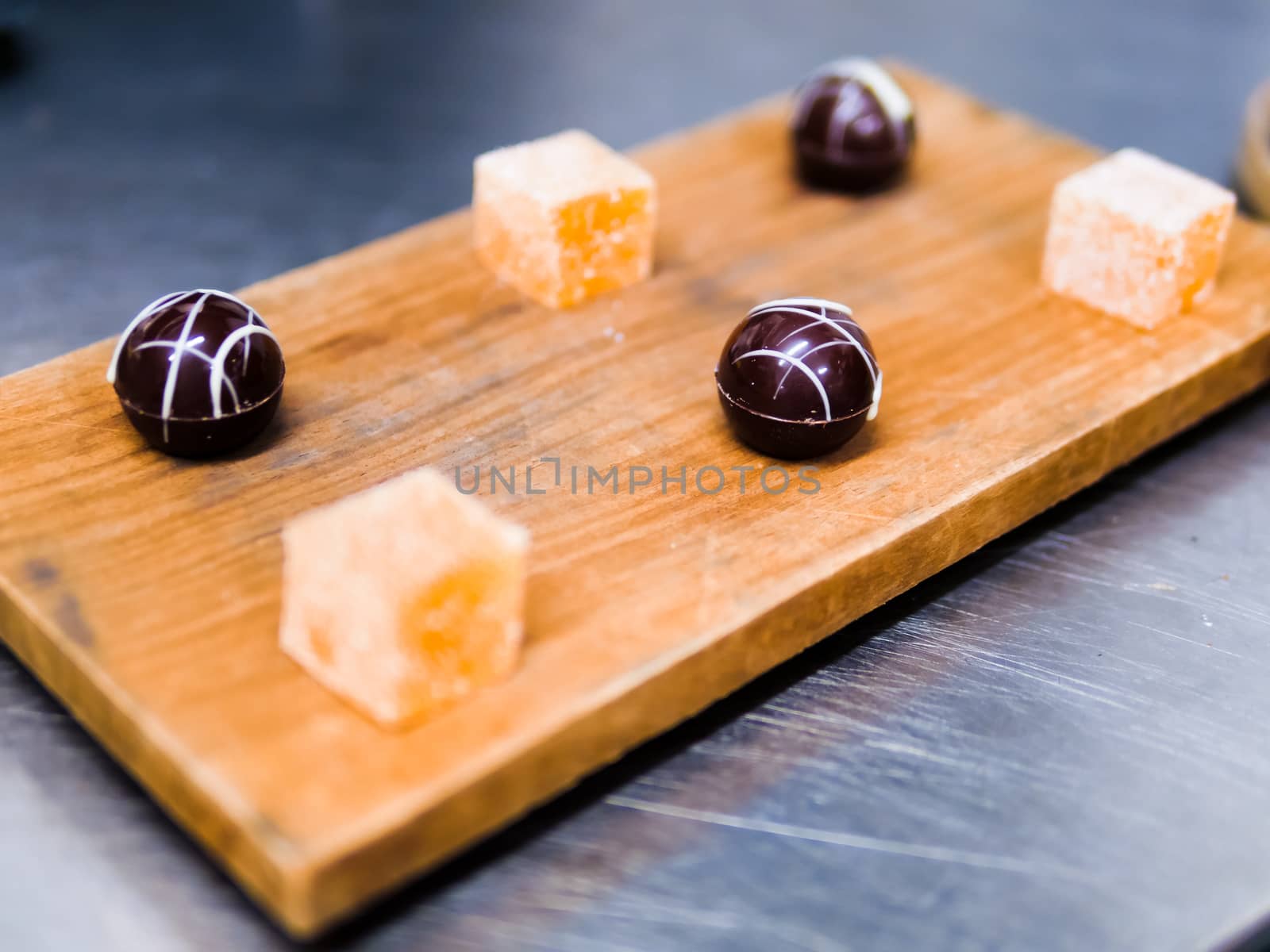 Passion Fruit Tart, Chi Chocolate Dessert Pieces on Wood