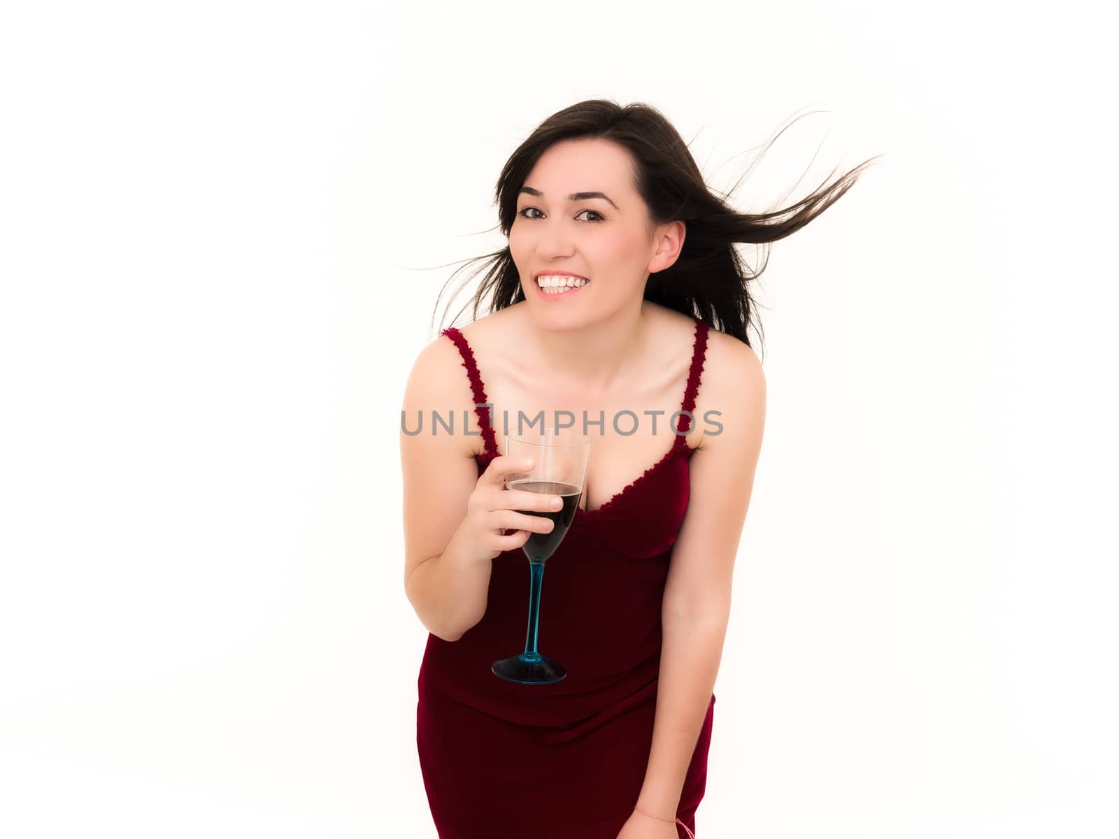 Woman Holding a Glass of Wine and Smiling Isolated Over White Background