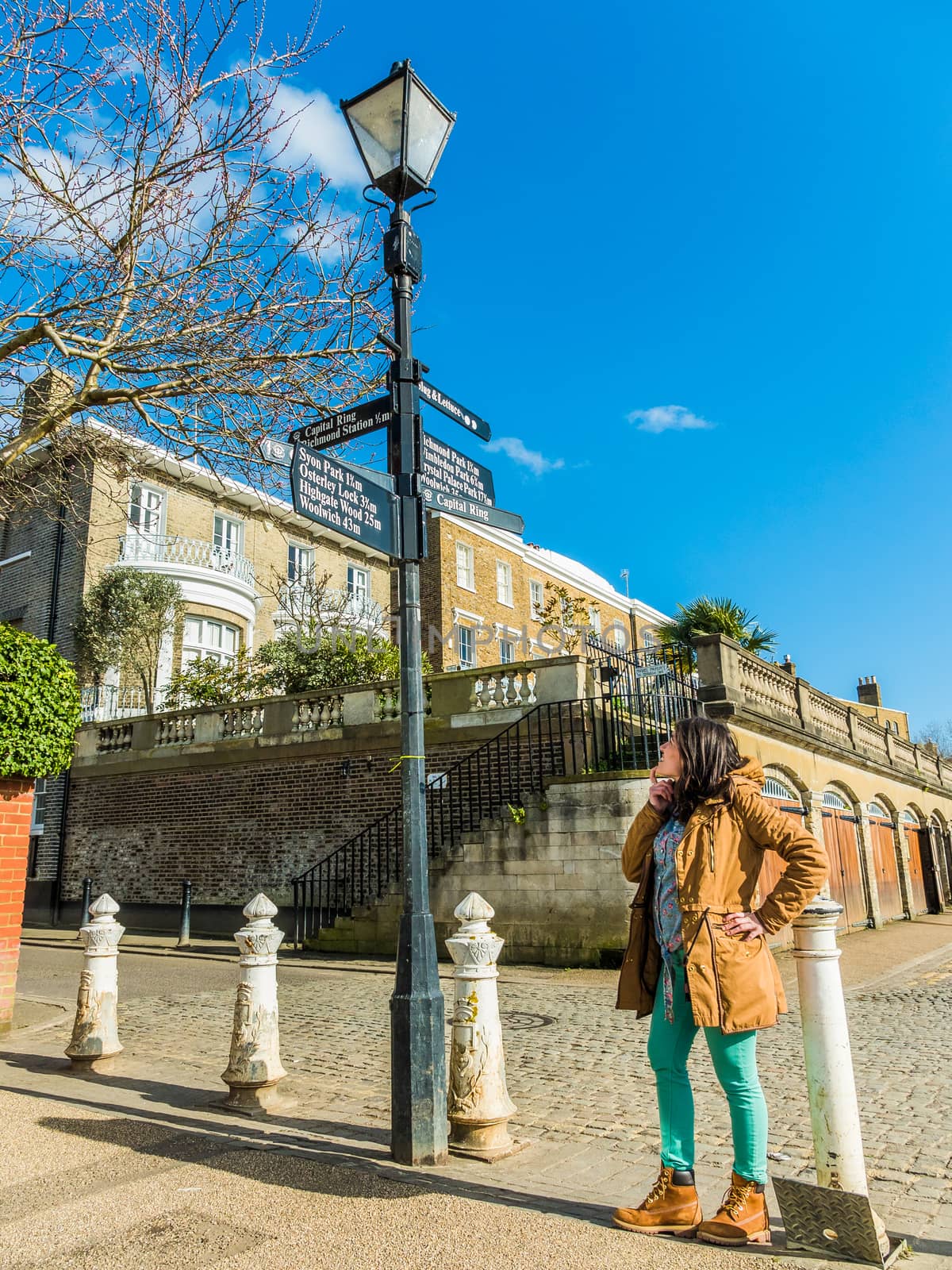 Woman Looking at a Sign Post and Thinking