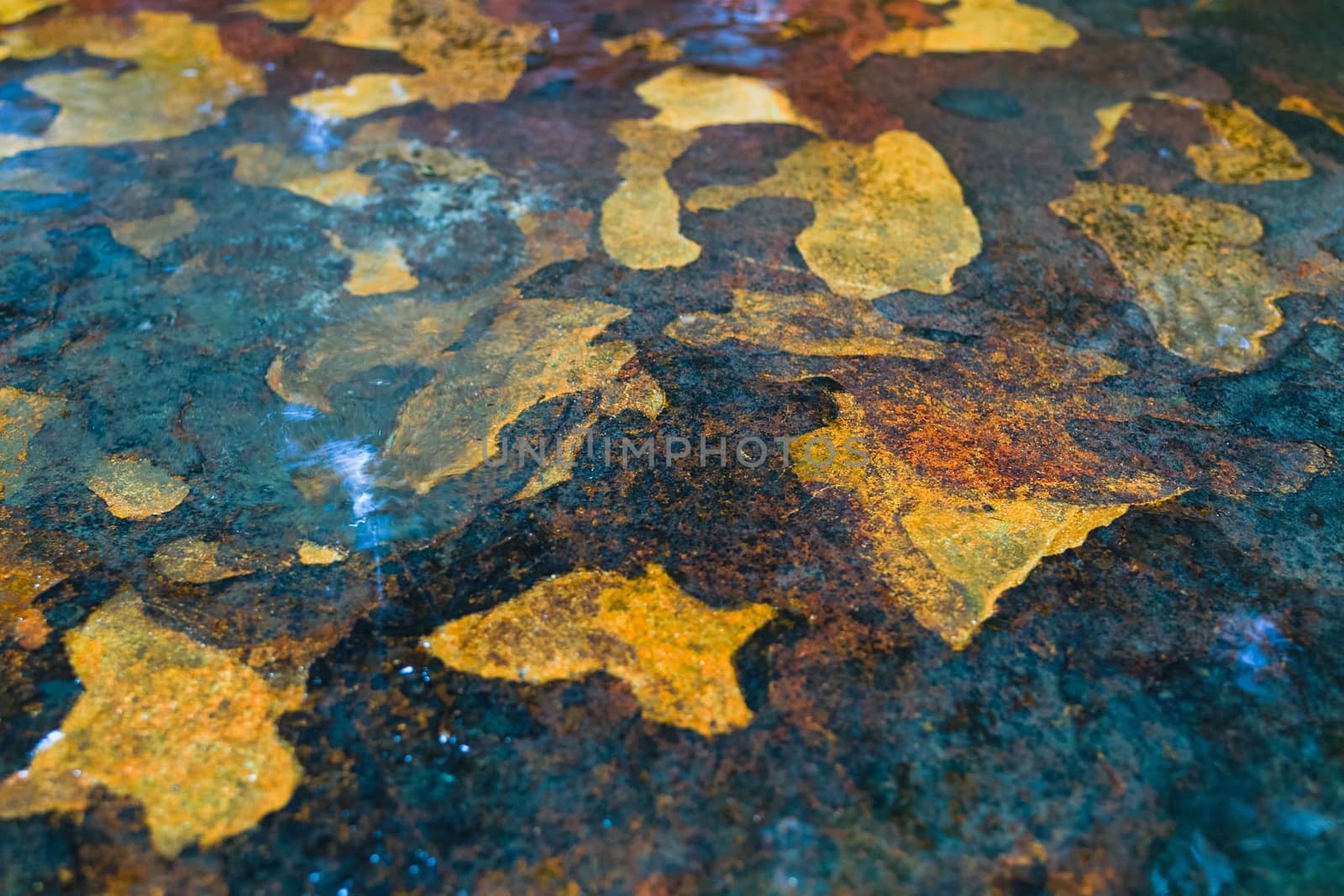 Background of rock with yellow orange patterns by jaaske