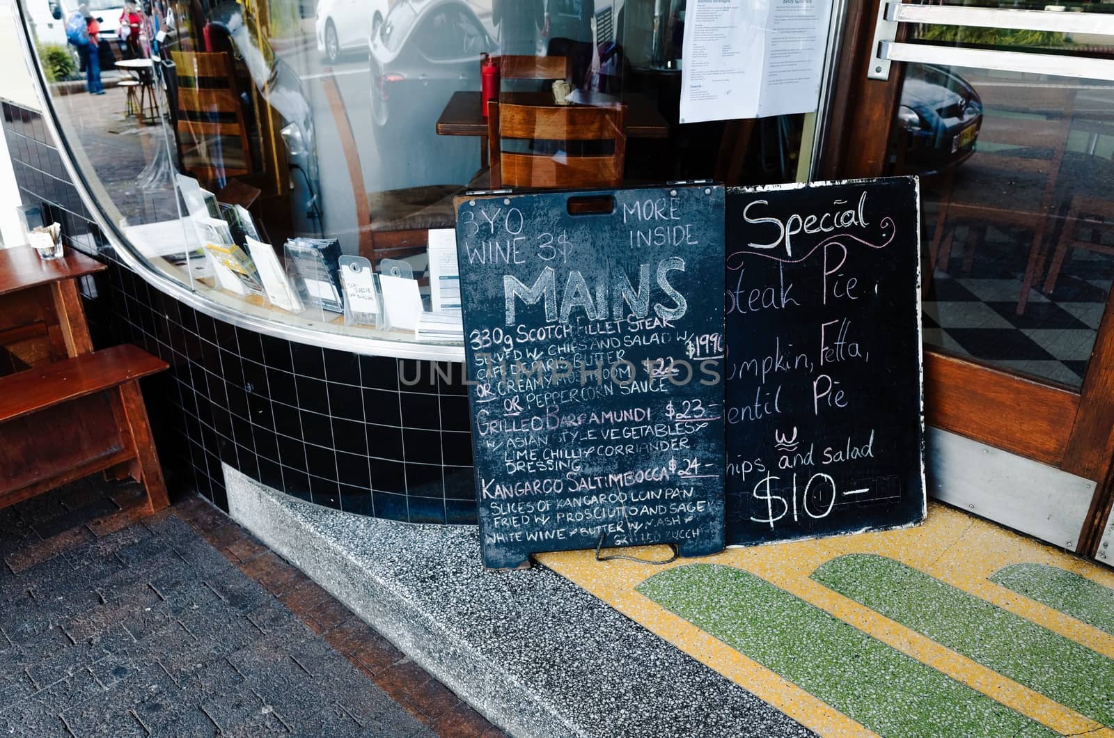 Chalkboard Menu in Front of a Restaurant by jaaske