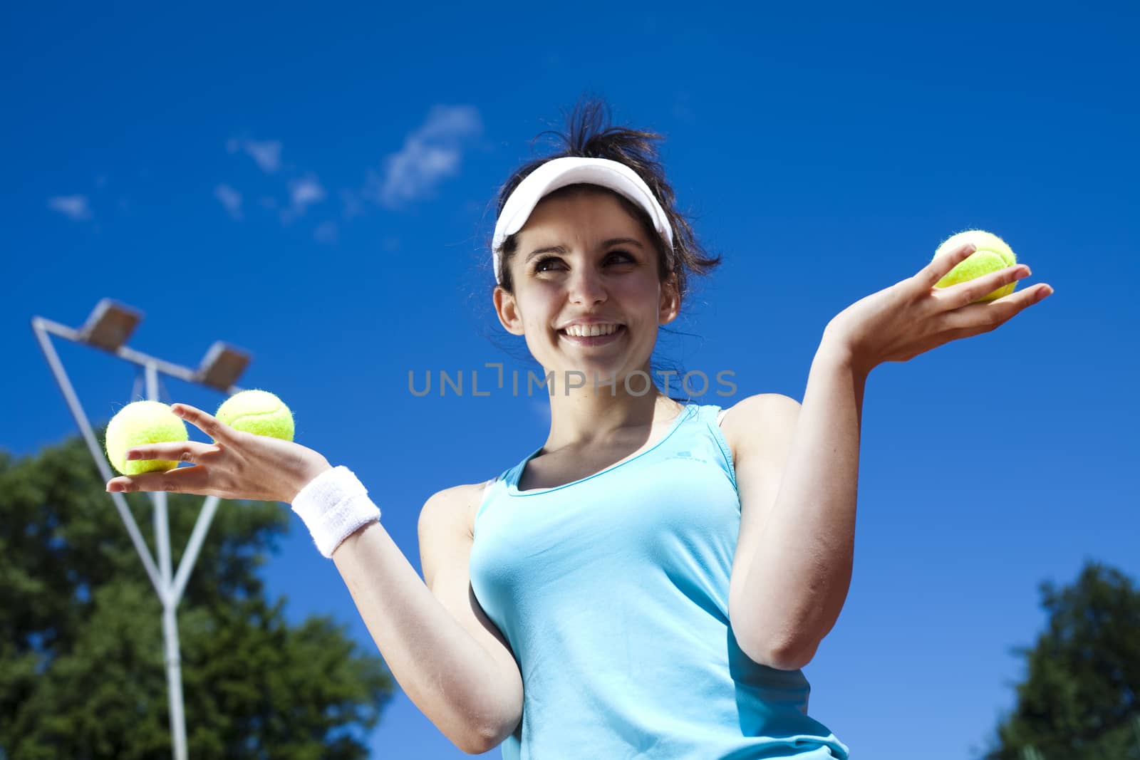 Girl playing tennis on the court