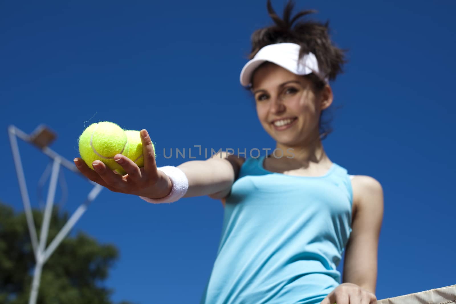 Girl playing tennis on the court