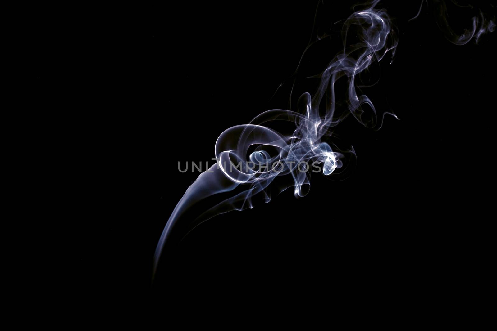 Swirls of smoke on a black background.