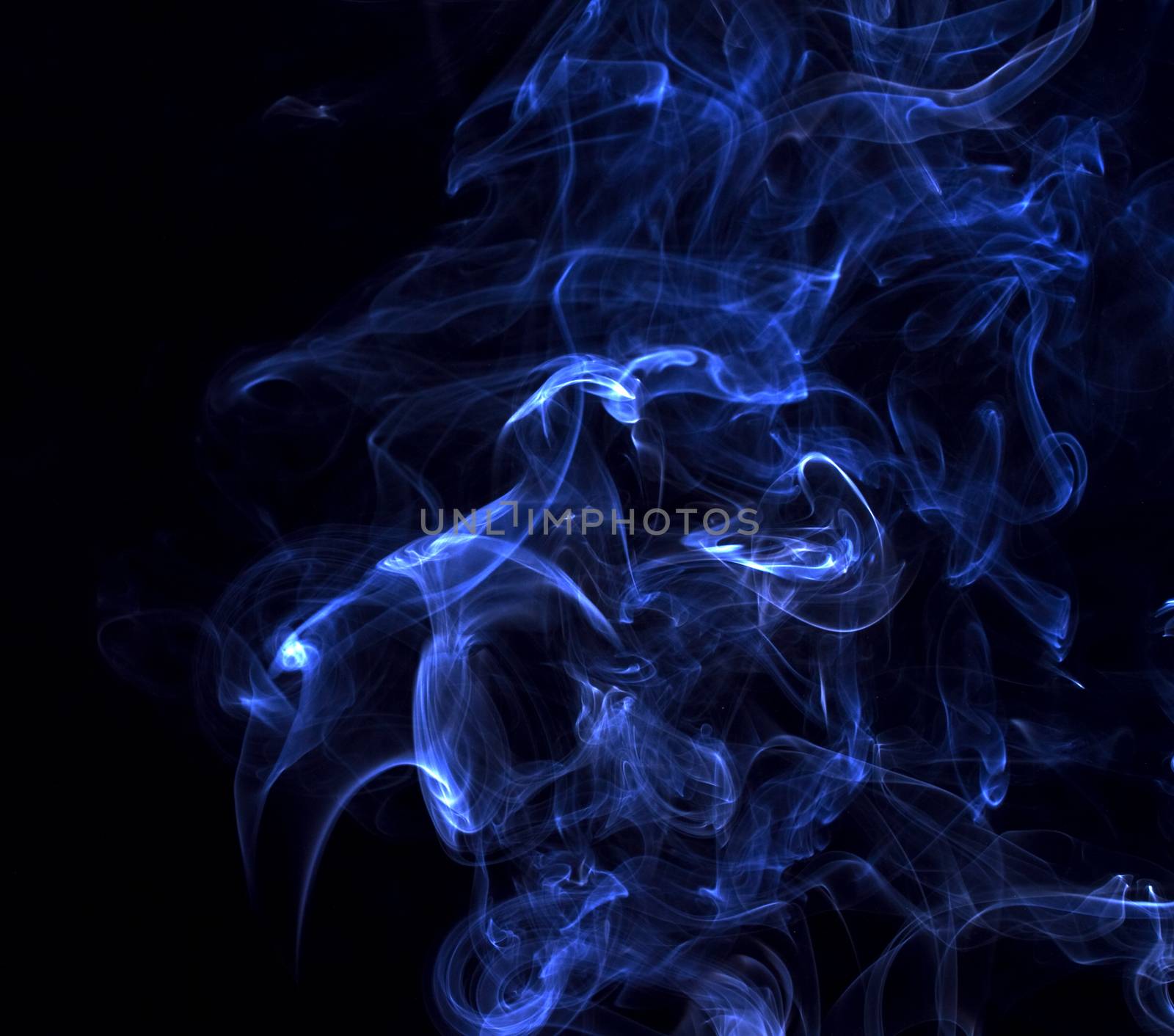 Blue smoke swirl on black background.