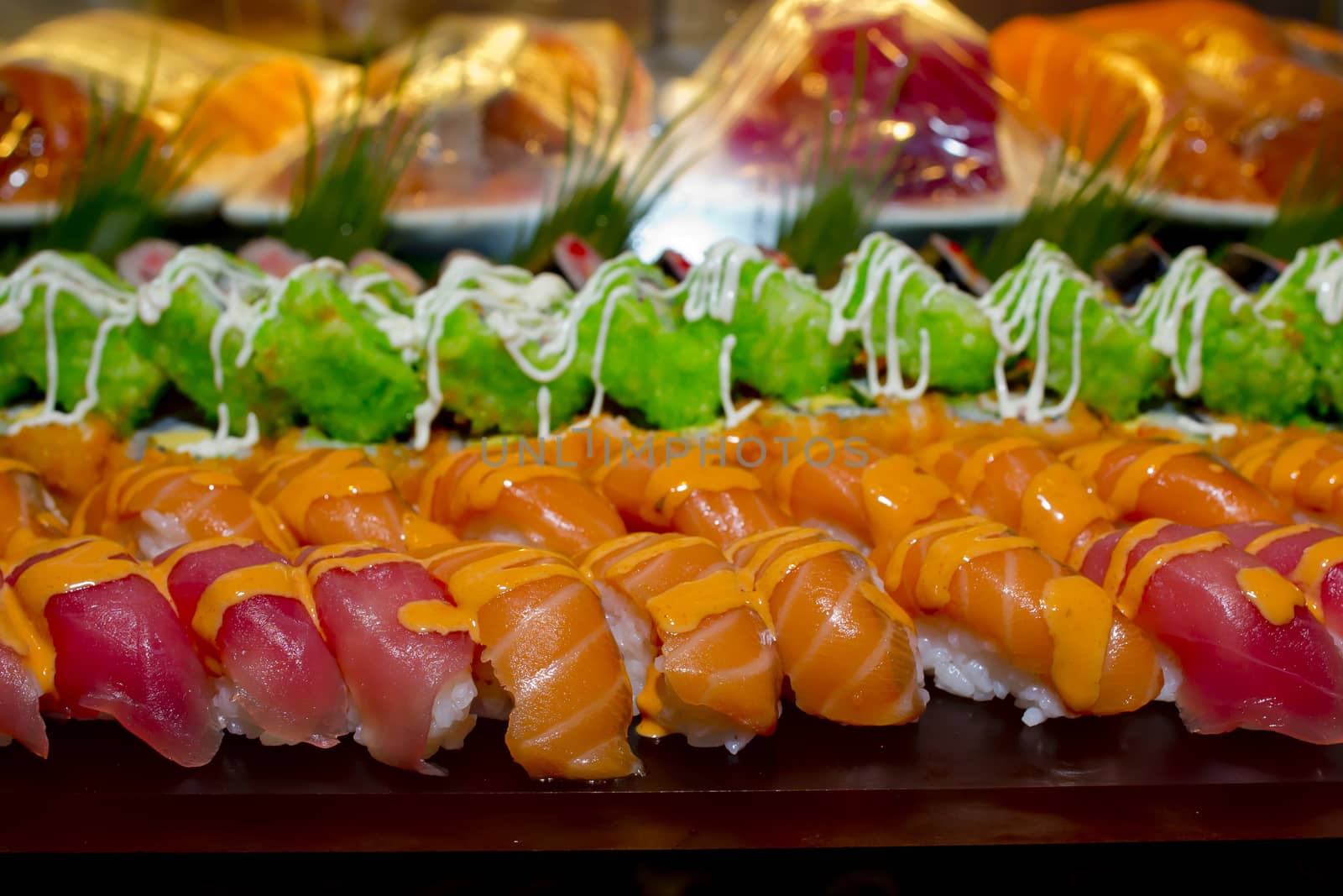 Japanese Cuisine -Buffet catering style Sushi Set in restaurant - salmon Maki Sushi and Nigiri Sushi