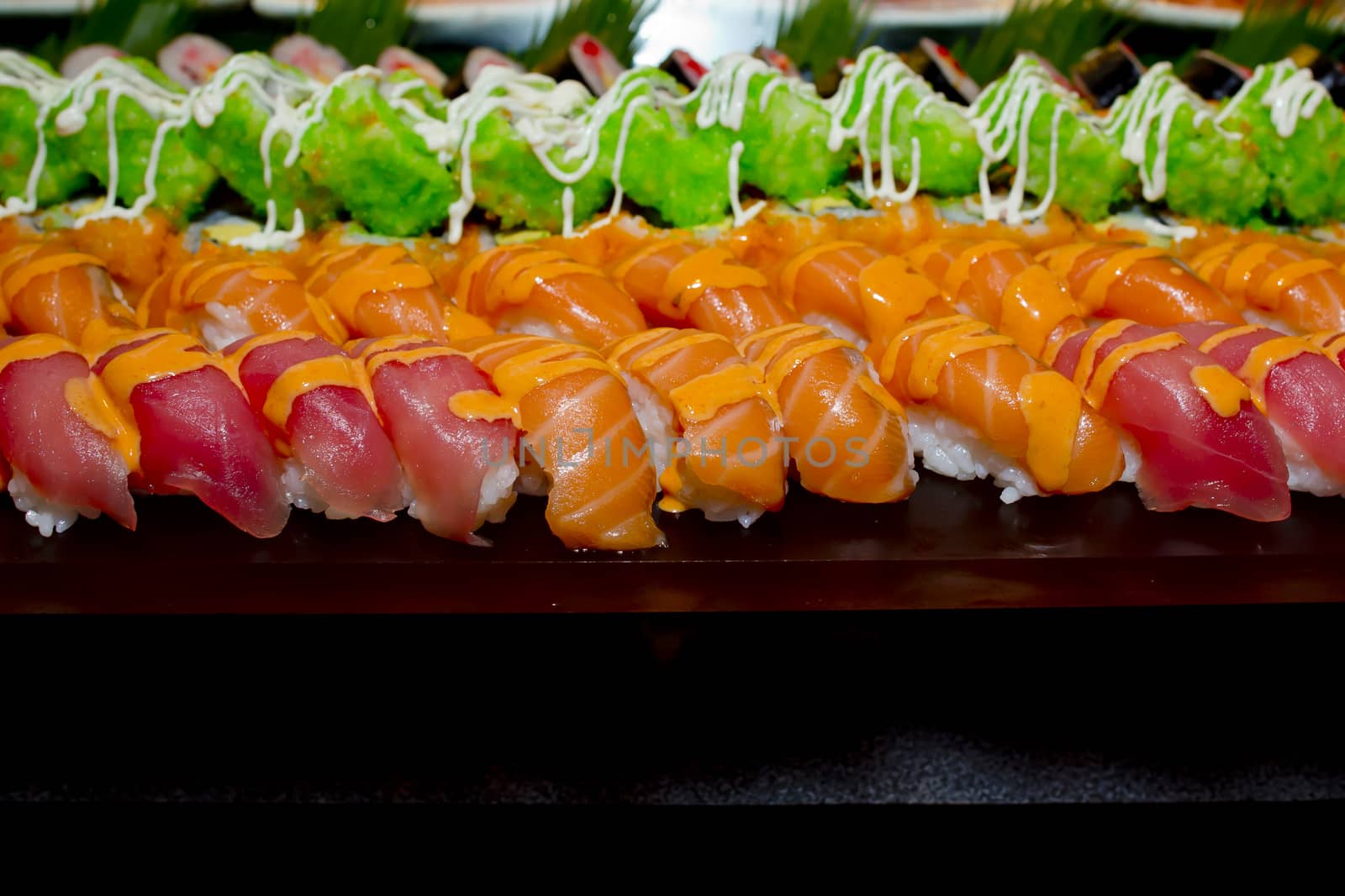 Japanese Cuisine -Buffet catering style Sushi Set in restaurant - salmon Maki Sushi and Nigiri Sushi