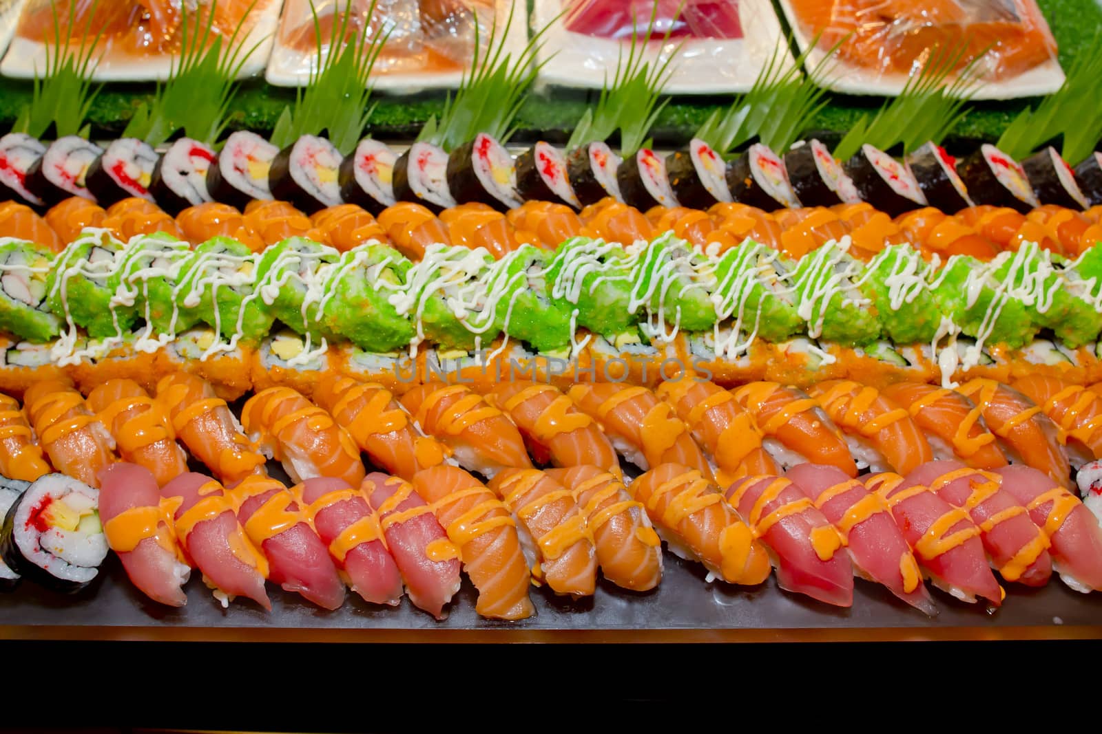 Japanese Cuisine -Buffet catering style Sushi Set in restaurant - salmon Maki Sushi and Nigiri Sushi