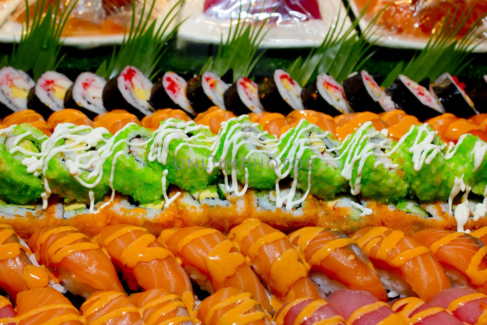 Japanese Cuisine -Buffet catering style Sushi Set in restaurant - salmon Maki Sushi and Nigiri Sushi