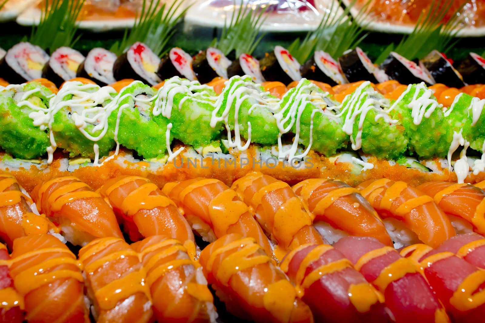 Japanese Cuisine -Buffet catering style Sushi Set in restaurant - salmon Maki Sushi and Nigiri Sushi