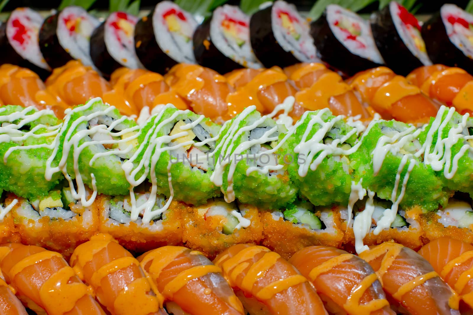 Japanese Cuisine -Buffet catering style Sushi Set in restaurant - salmon Maki Sushi and Nigiri Sushi