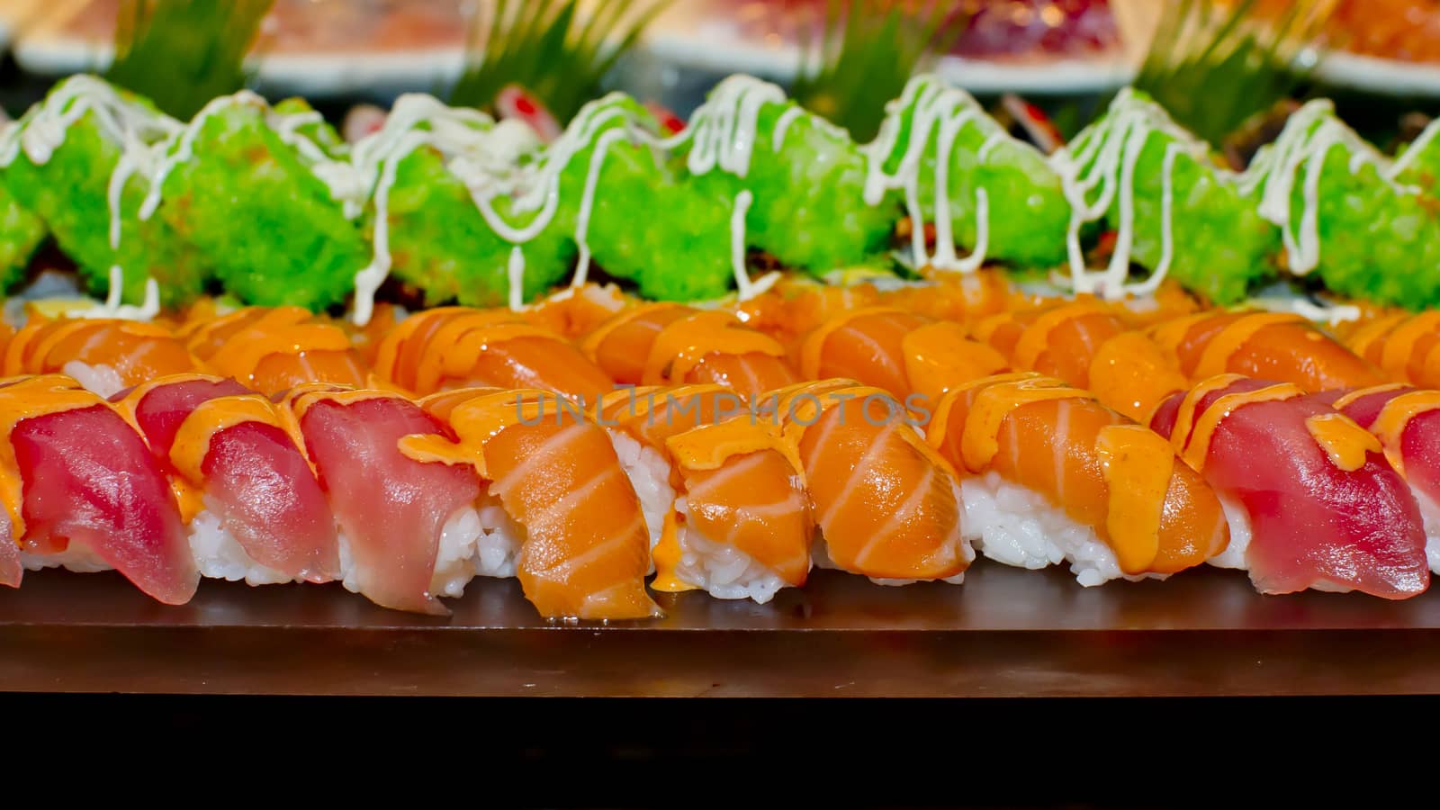 Japanese Cuisine -Buffet catering style Sushi Set in restaurant - salmon Maki Sushi and Nigiri Sushi