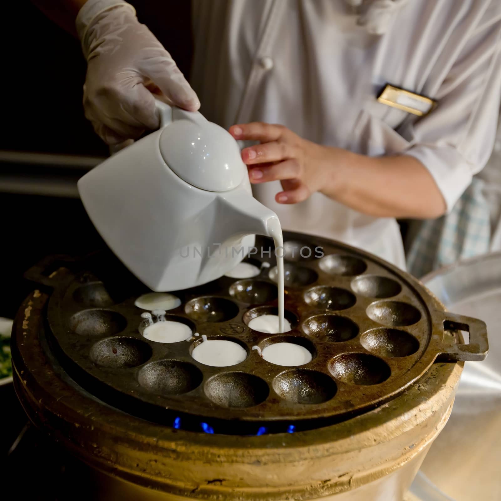 Kind of Thai sweetmeat. Coconut milk mix with powder fried dessert.