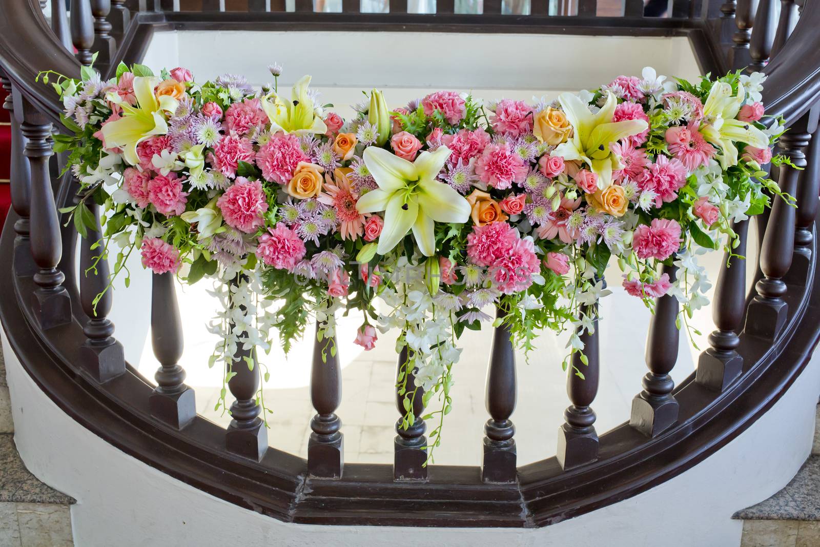 floral decorate in handrail of stairs at the wedding