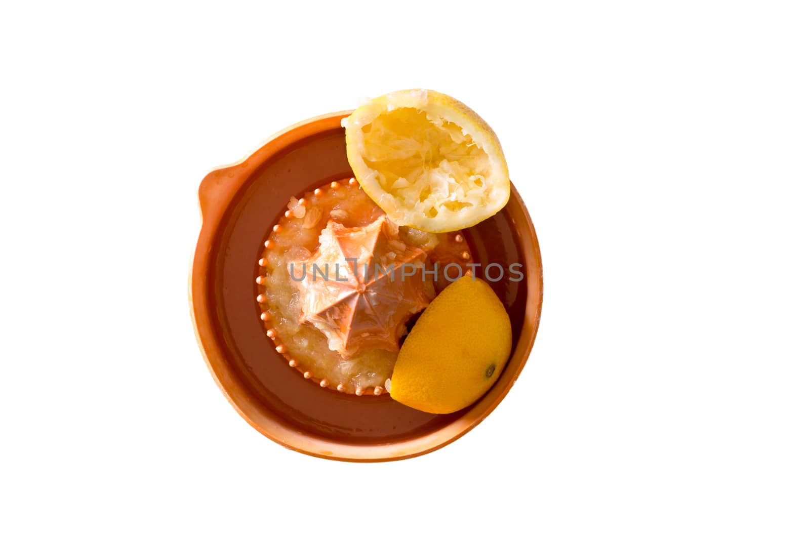 High Angle View of Squeezed Fresh Lemon on a Squeezer, Isolated on White Background.