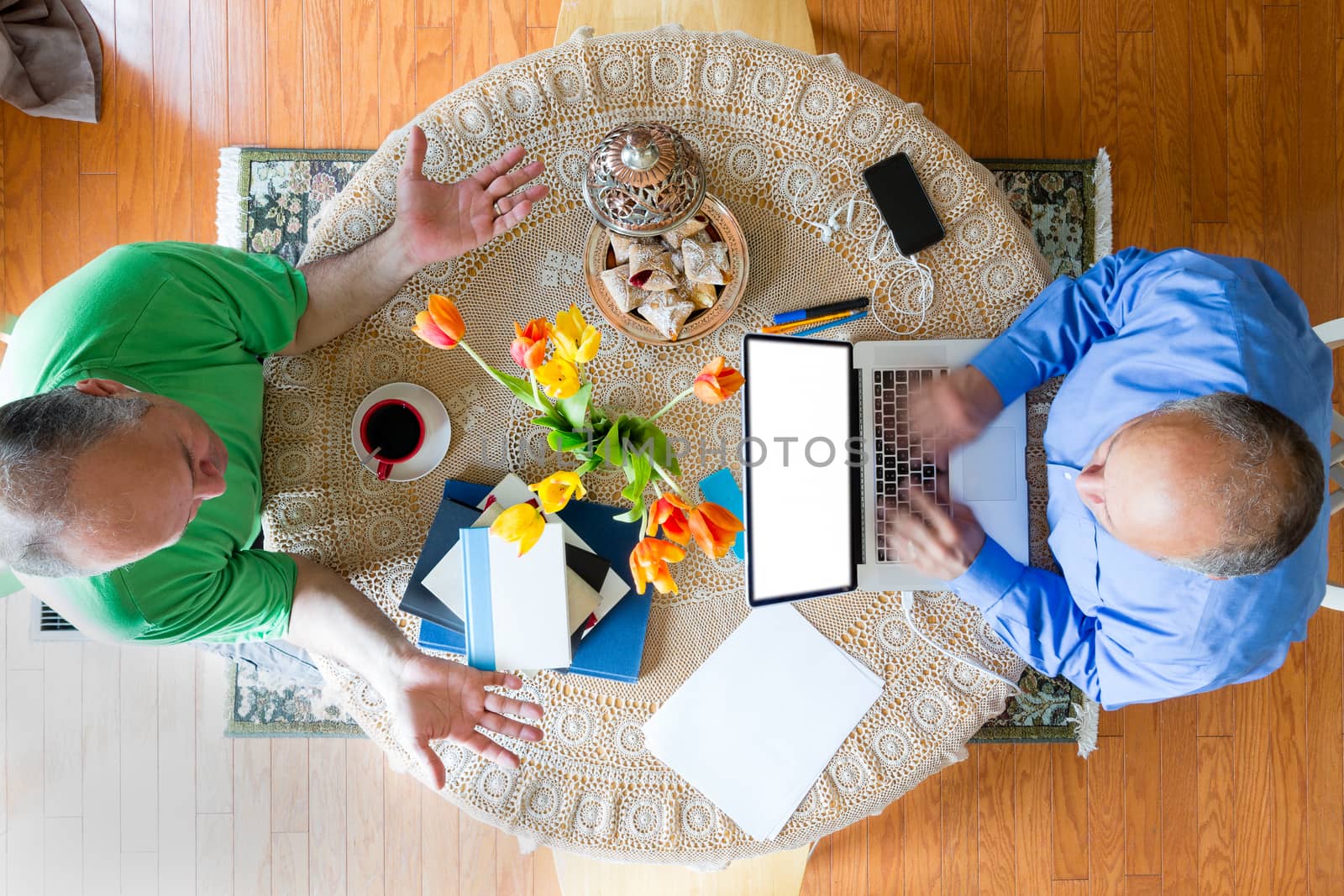 Two Businessmen at the Table in High Angle View by coskun