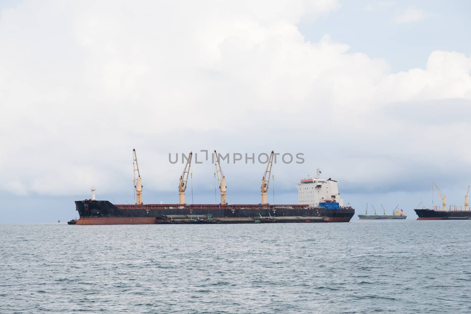 Cargo ship. Parking in the sea to await transportation to the port.