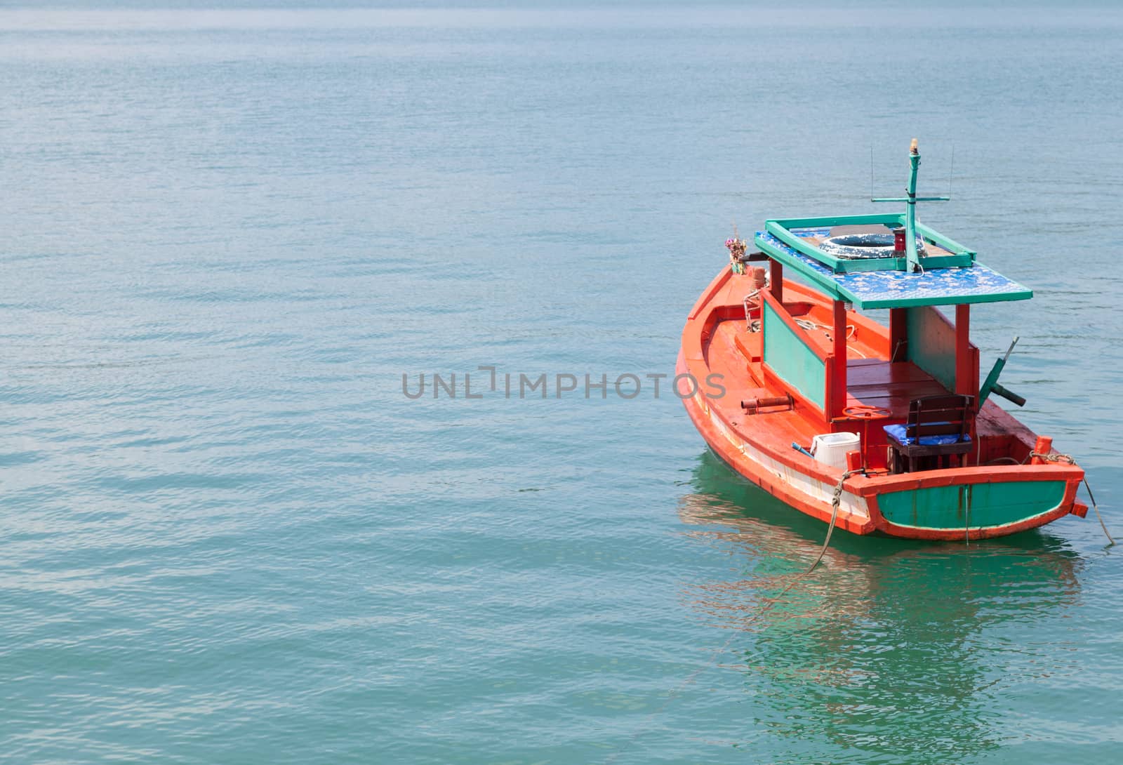 Small fishing boats Parking in the sea near the island dock.