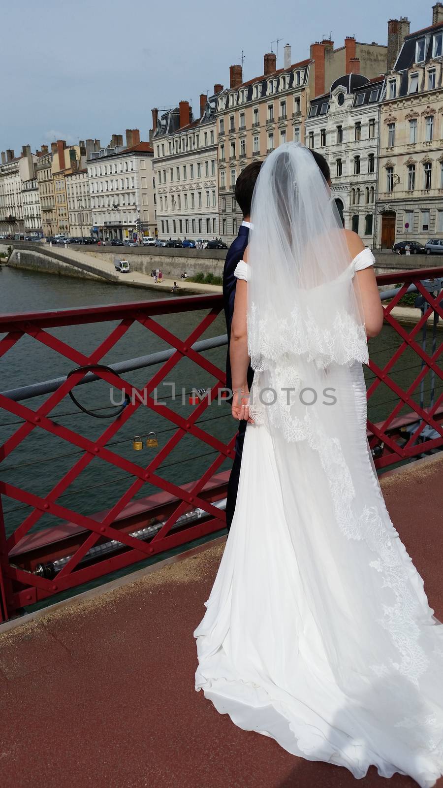 Just married couple on the small bridge. Lyon, France