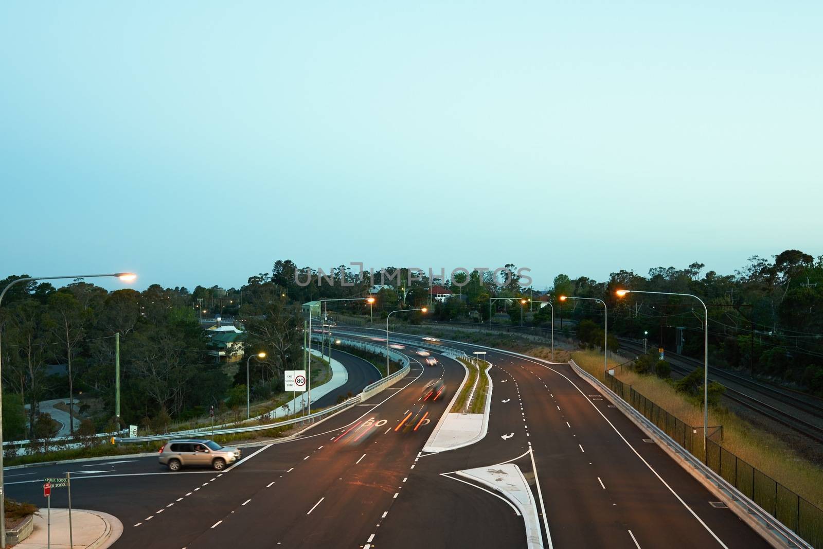 Cars driving at dusk by jaaske