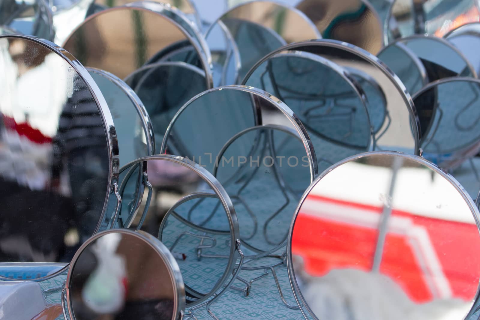a multitude of mirrors posing in a market
