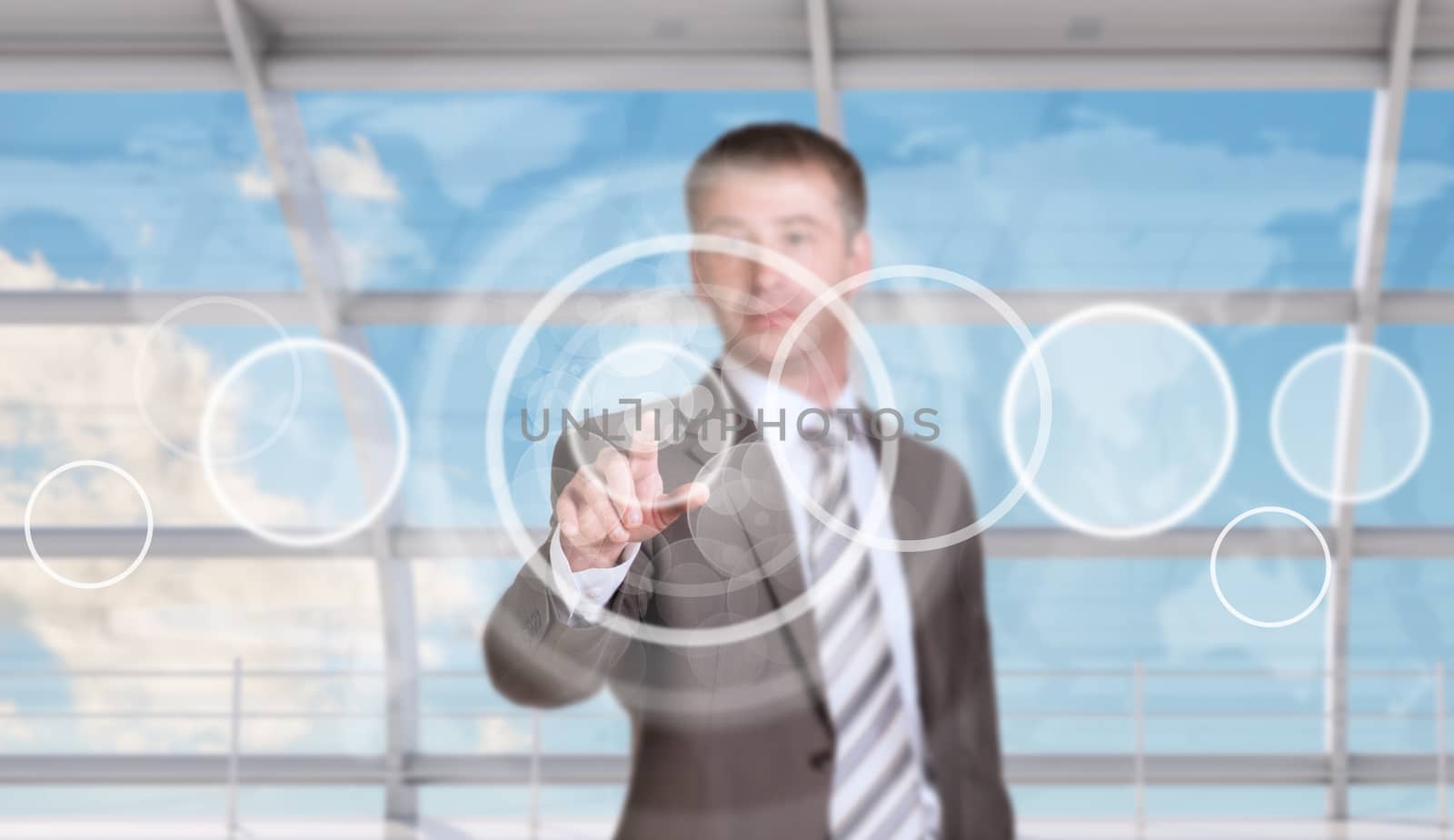 Businessman pressing on holographic screen on virtual world map background