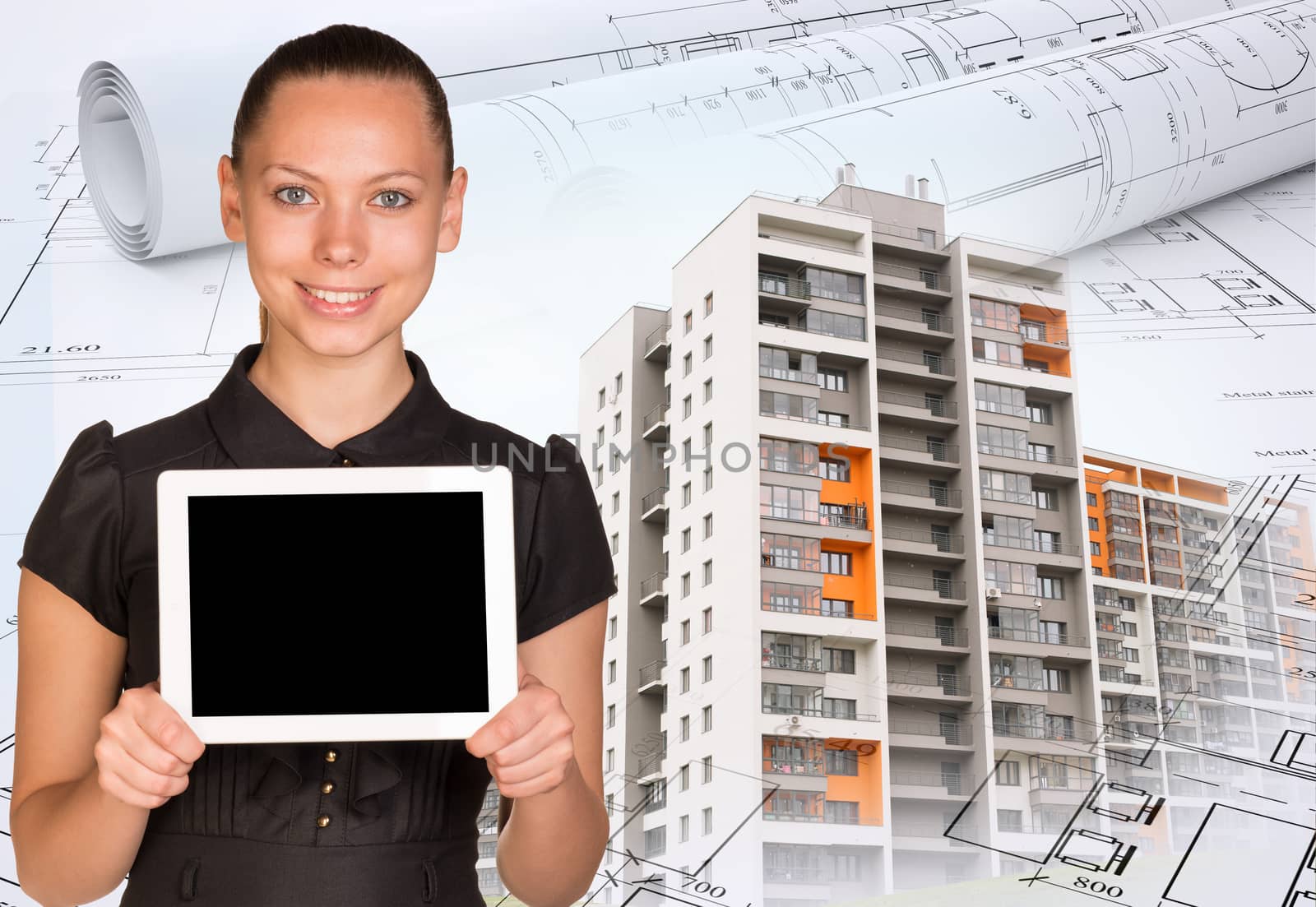 Smiling young woman holding tablet and looking at camera on abstract background with colorful buildings and graphs