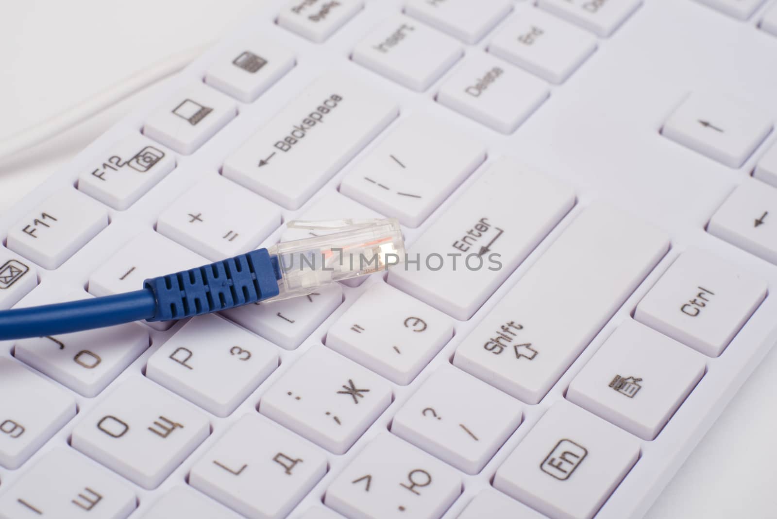 Blue computer cable with keyboard, close up view