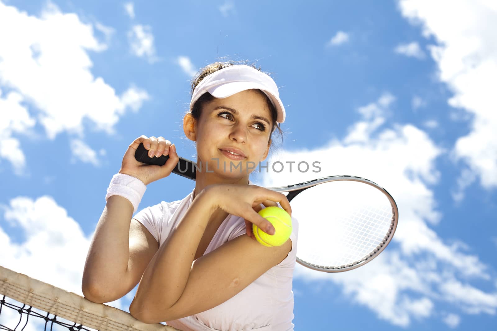 Woman playing tennis in summer