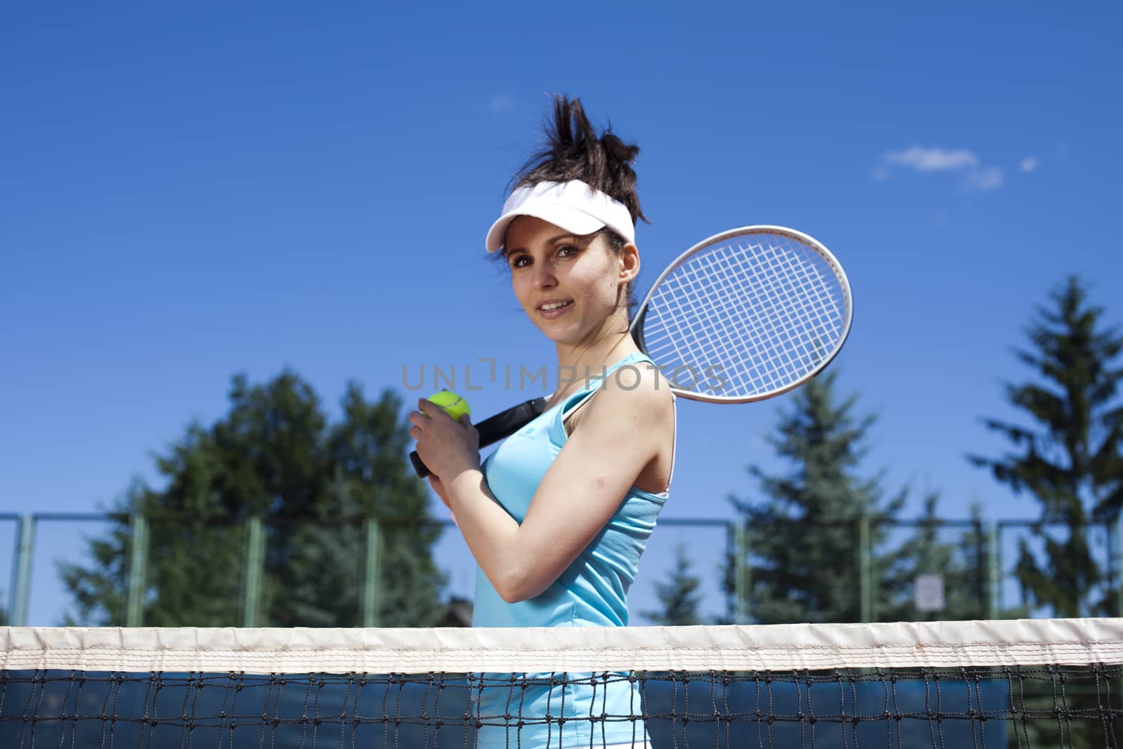 Woman playing tennis in summer