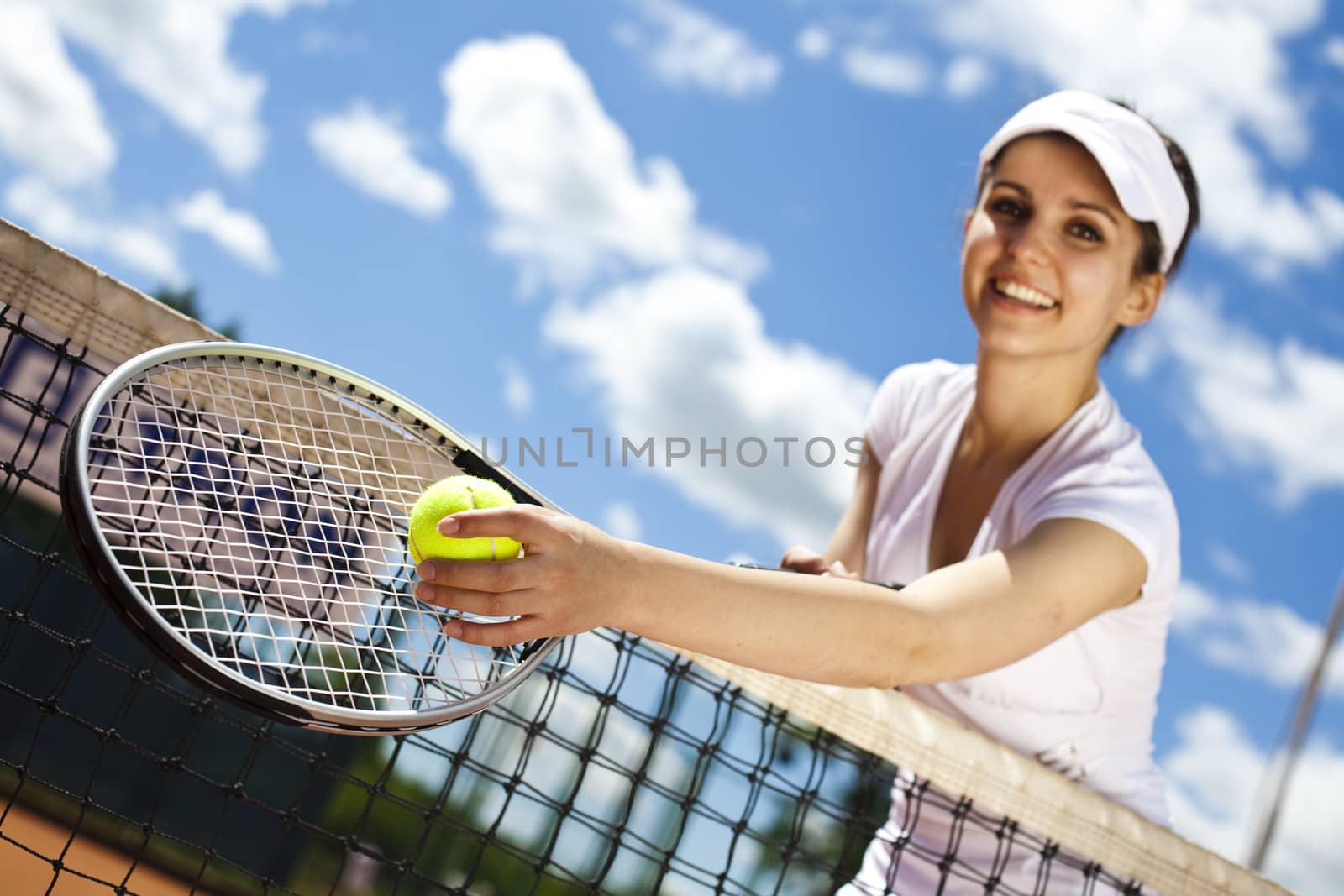 Woman playing tennis in summer