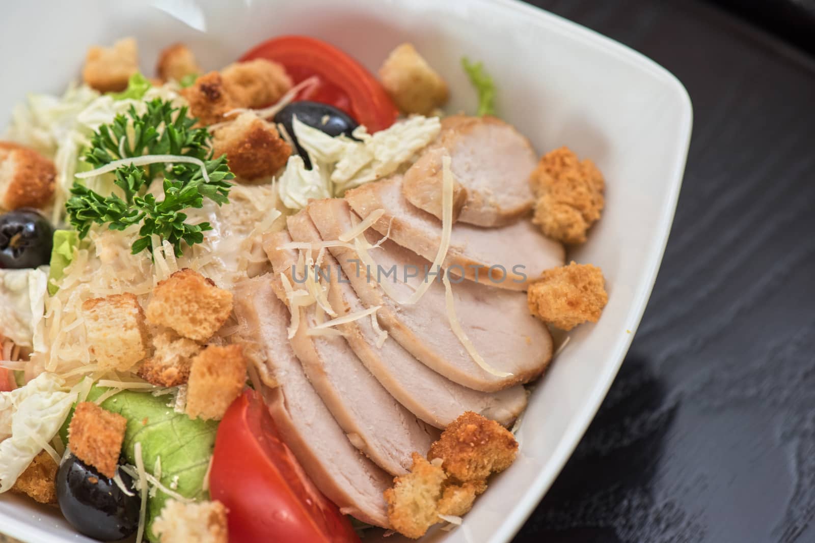 salad from ham crust cabbage, tomato cucumber olive greens and cheese 