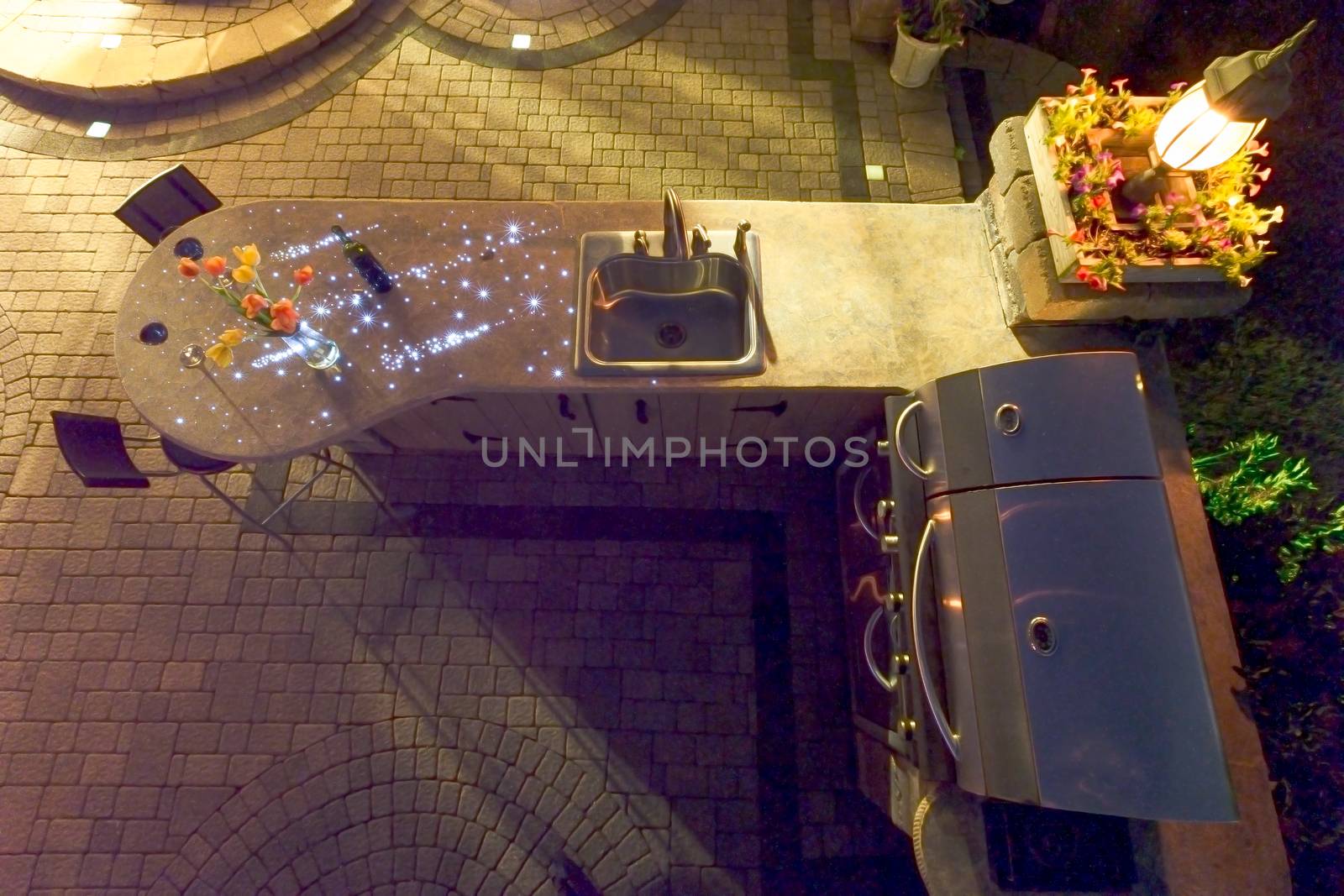 Night Shot of Outdoor Summer Kitchen with Fiberoptic Lights by coskun