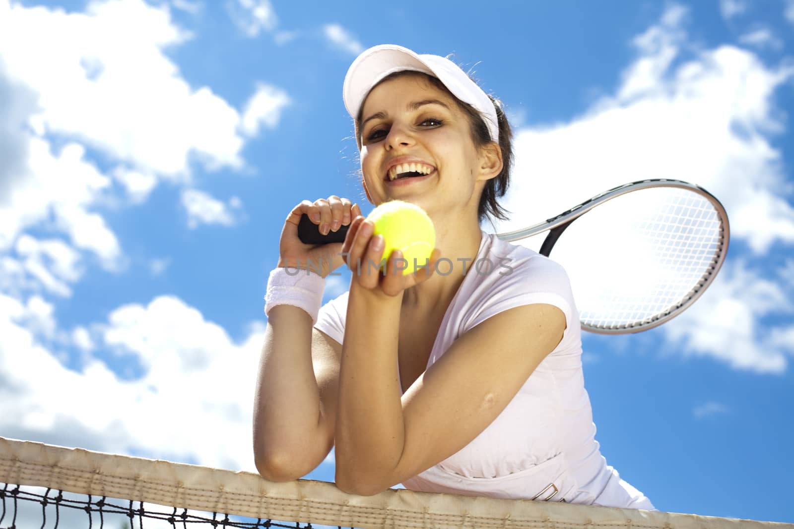 Young woman tennis player on the court