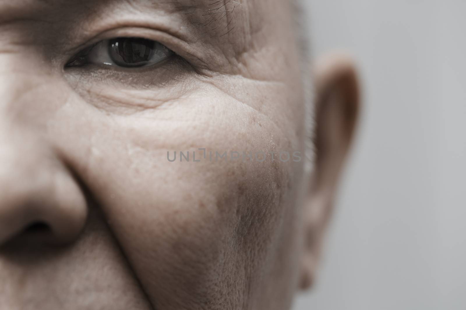 Face of elderly man looking at camera. Horizontal photo