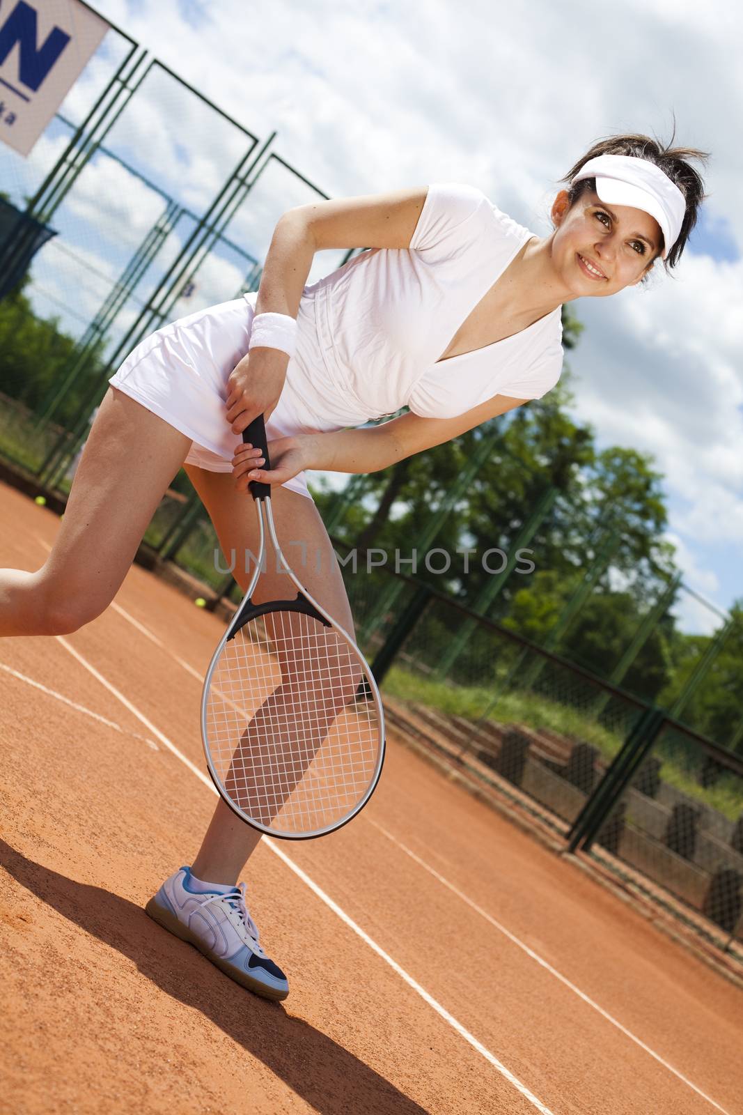 Young woman playing tennis, natural colorful tone by JanPietruszka